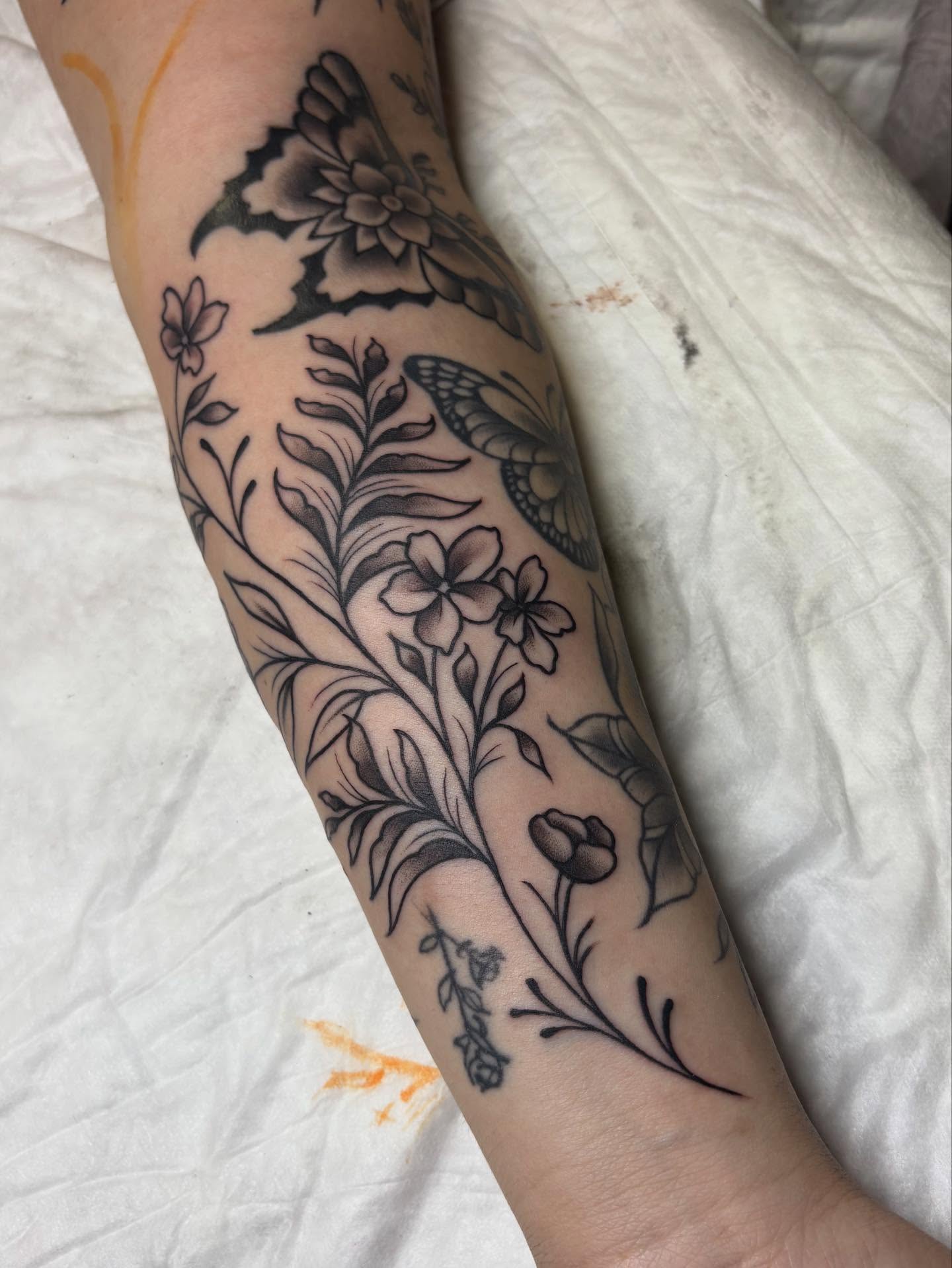 Floral design black and grey tattoo on the forearm by gia❤️‍🔥🎲, Maryville, Tennessee