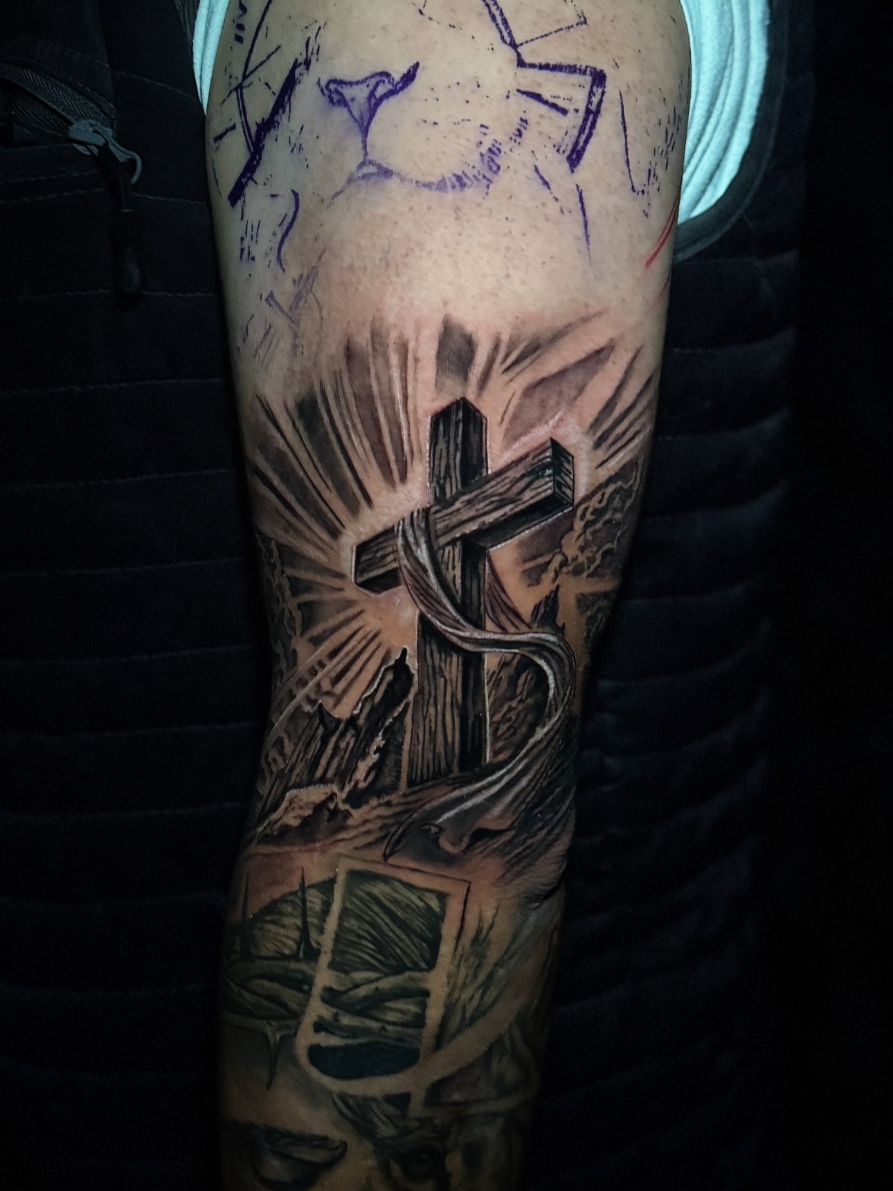 Cross and snake realism tattoo on the forearm by Paola Pineda Tattoo, Knoxville, Tennessee