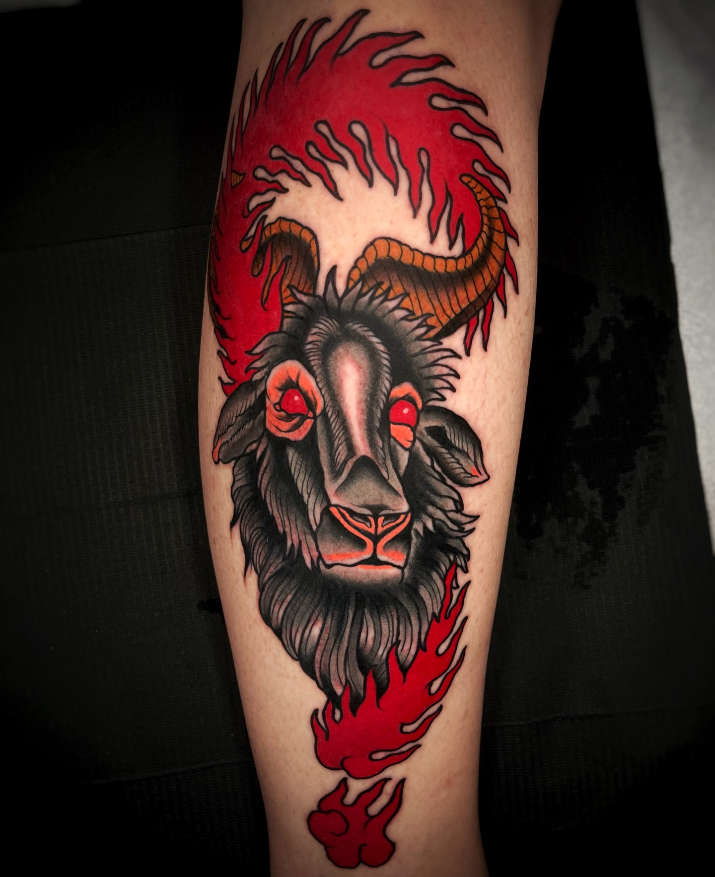 Ram head with flames American traditional tattoo on the forearm by Gilbert Gonzalez