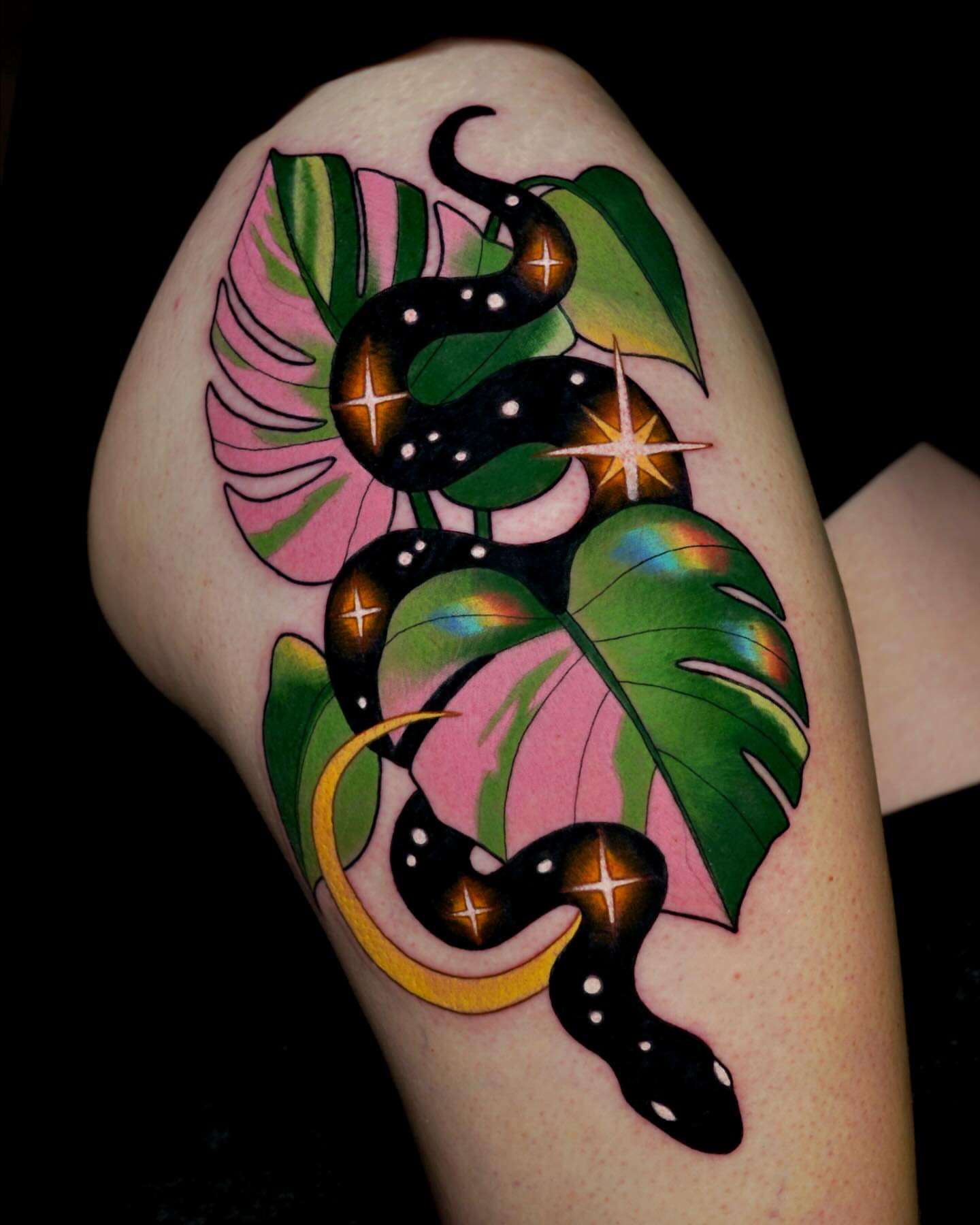 Snakes and leaves geometric tattoo on the upper arm by Brooke Borden