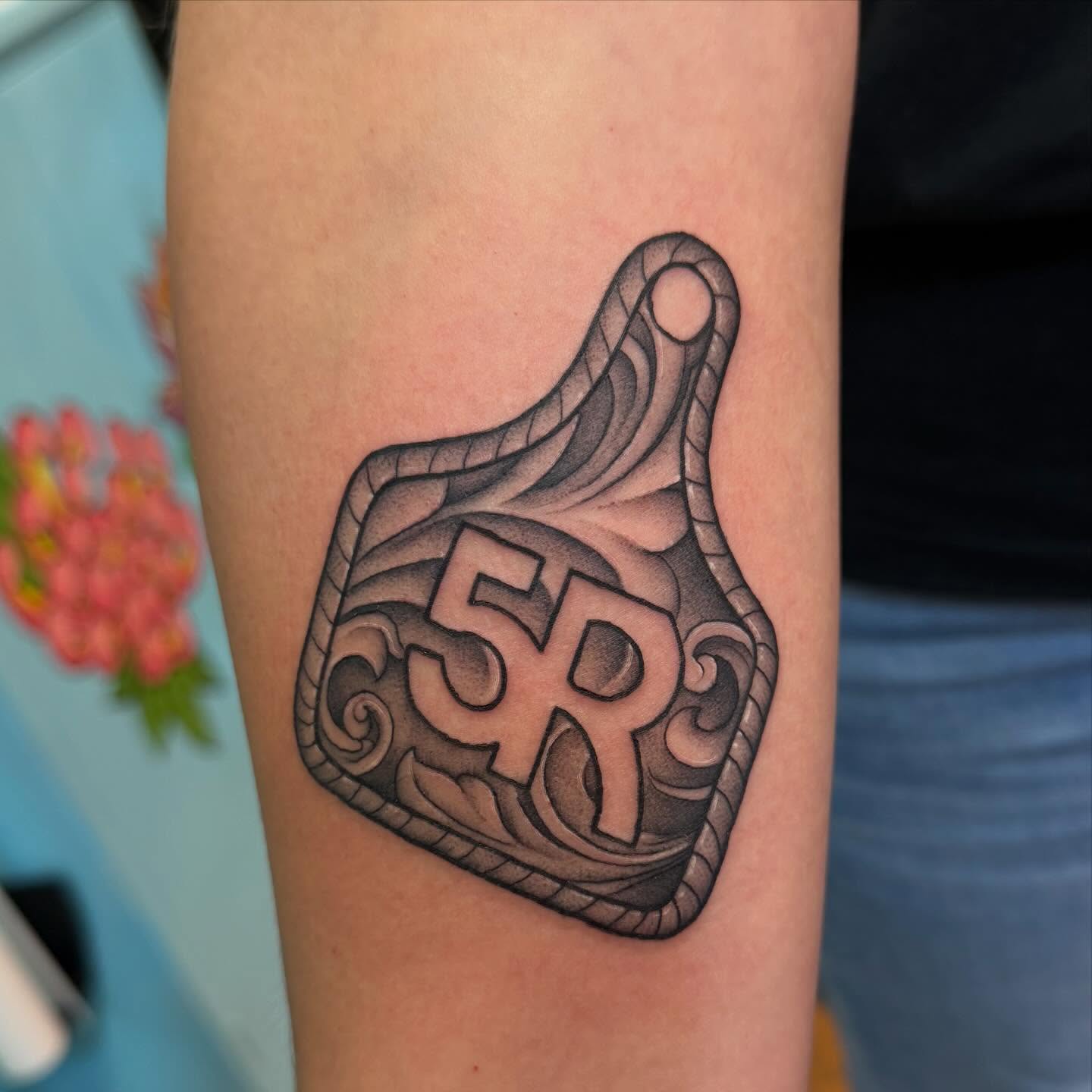 Number 59 black and grey tattoo on the forearm by Madilynn Klassen
