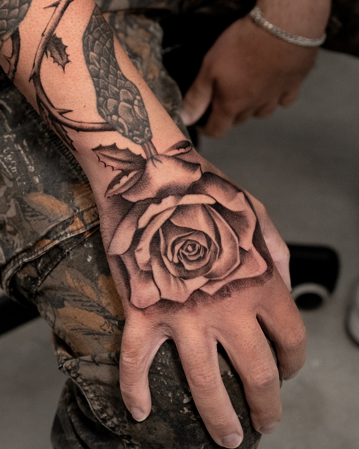 Rose realism tattoo on the hand by Mateo