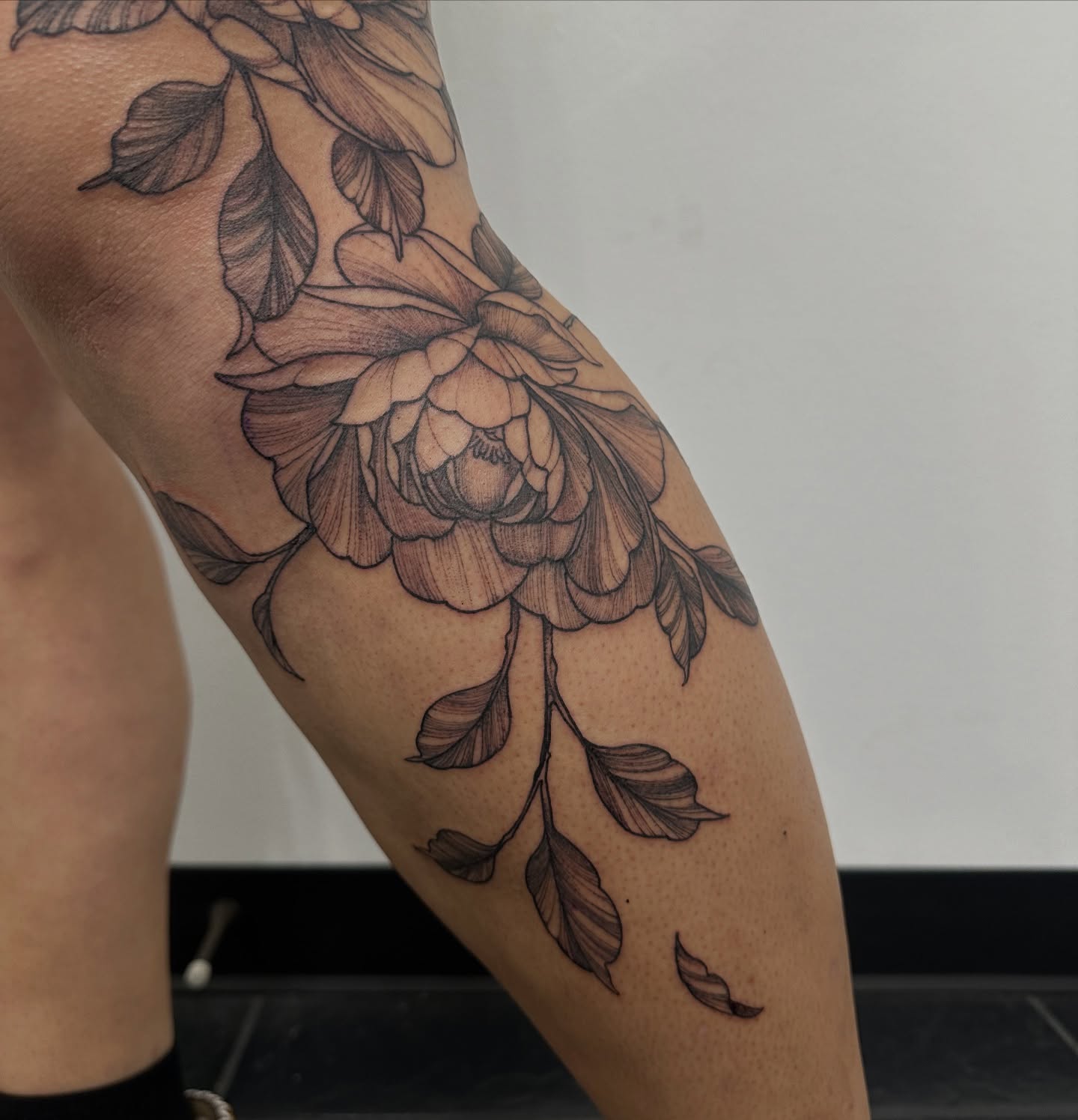 Peony flower black and grey tattoo on the forearm by ๐ฌ๐๐๐ฏ๐ ๐ฆ ๐๐ฉ๐ฆ๐ท๐๐๐ข๐ฑ๐ฅ ๐ซง๐ผ, Joplin, Missouri