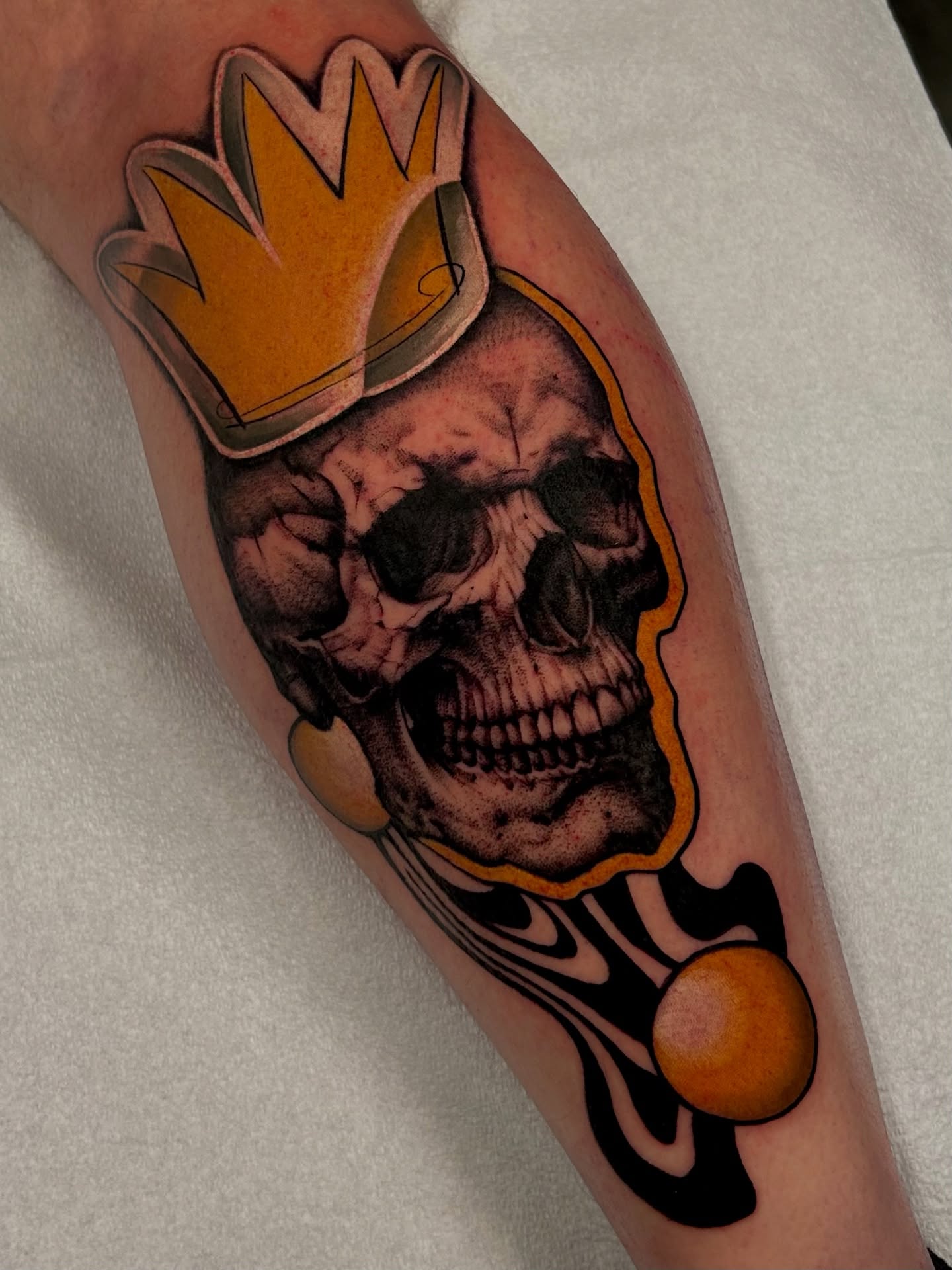Skull wearing crown American traditional tattoo on the forearm by Kim Goff - Special K