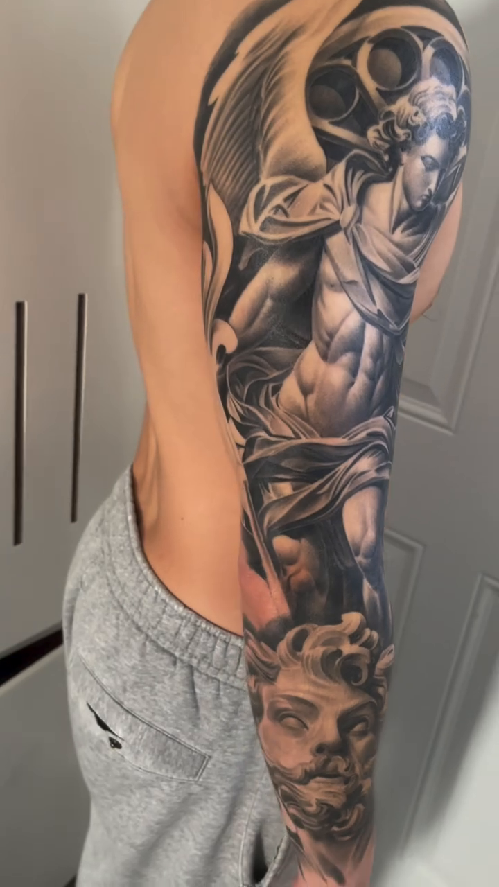Angel and classical sculpture realism tattoo by Antonio Pavić, Los Angeles, California