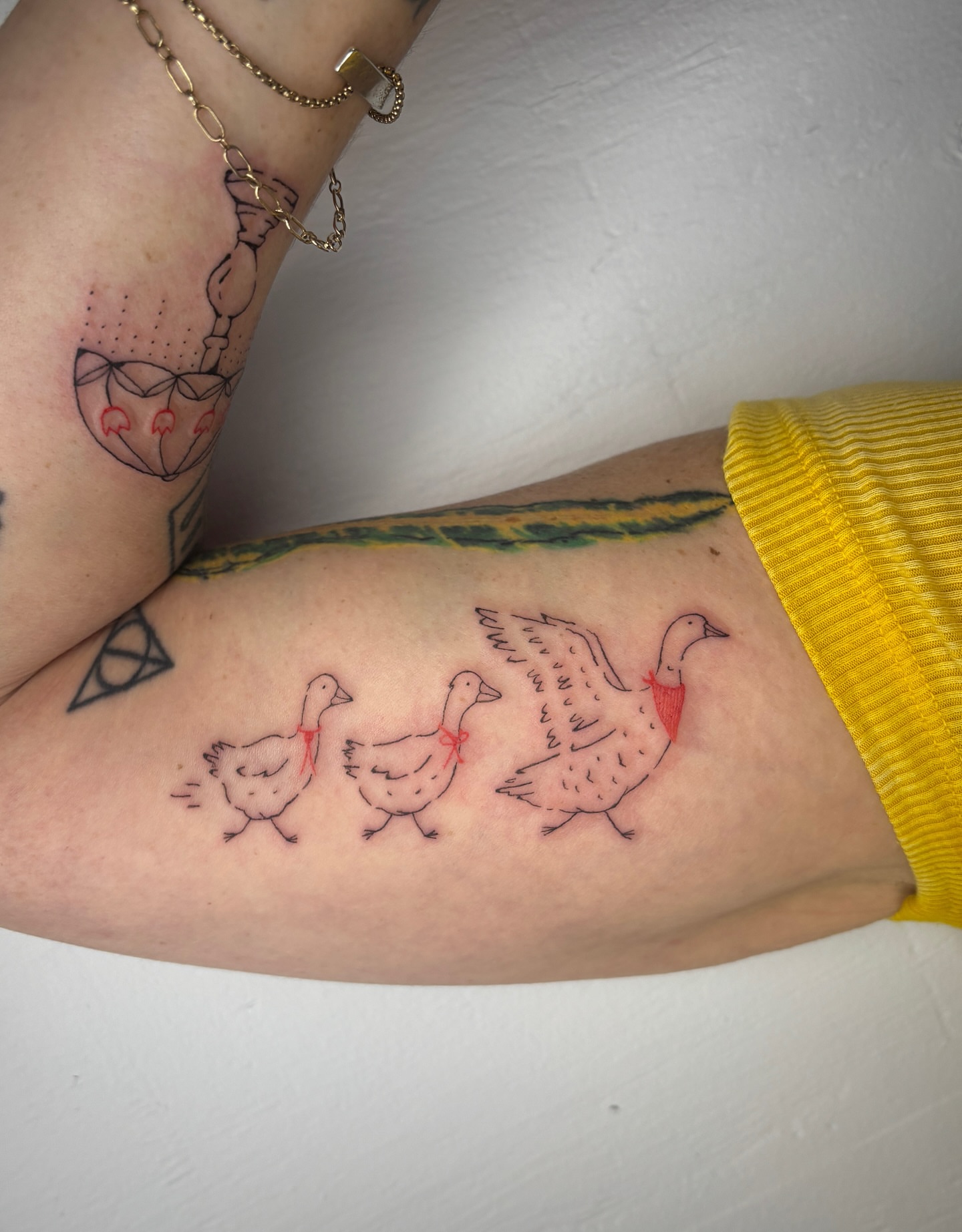 Geese family dotwork tattoo on the forearm by Raye