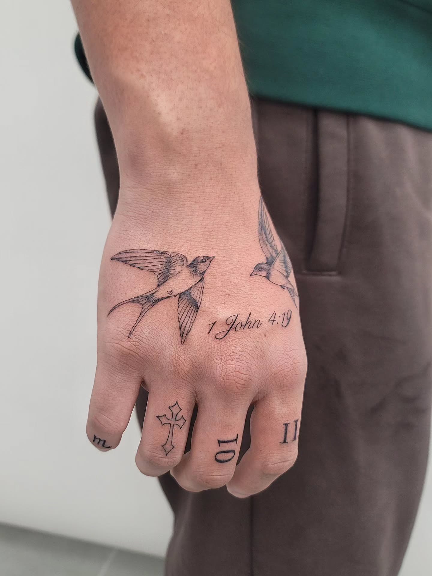 Birds and scripture black and grey tattoo on the hand by Las Vegas Fine Line Tattoos