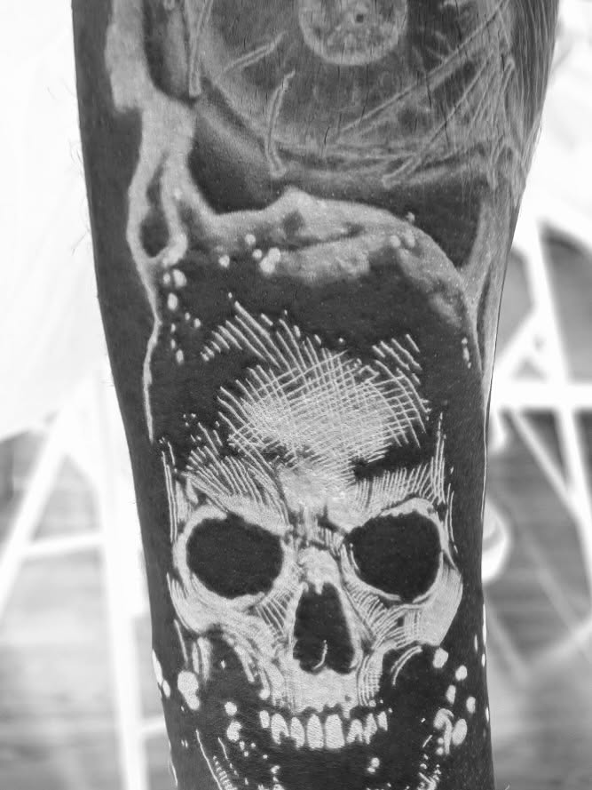 Skull realism tattoo on the forearm by Justin Fiveson