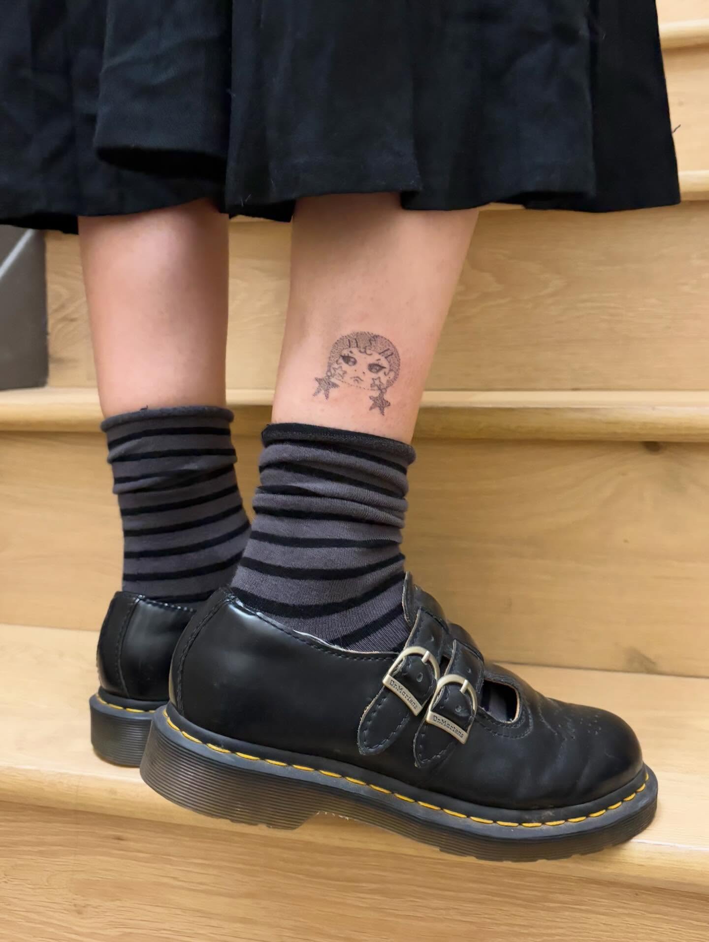 Moon and stars black and grey tattoo on the calf by kari