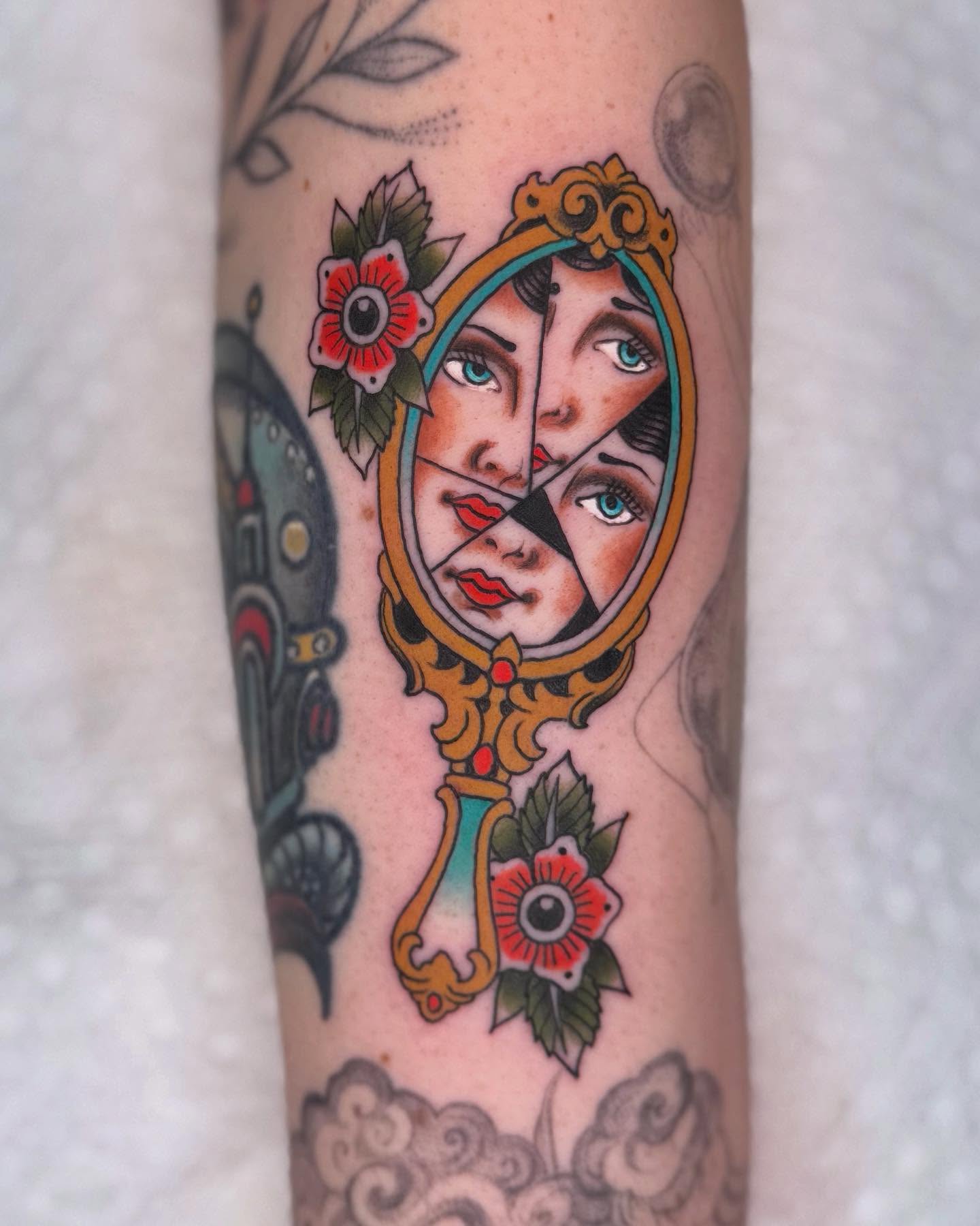 Mirror reflection American traditional tattoo on the forearm by Curtis Stairs, Seattle, Washington
