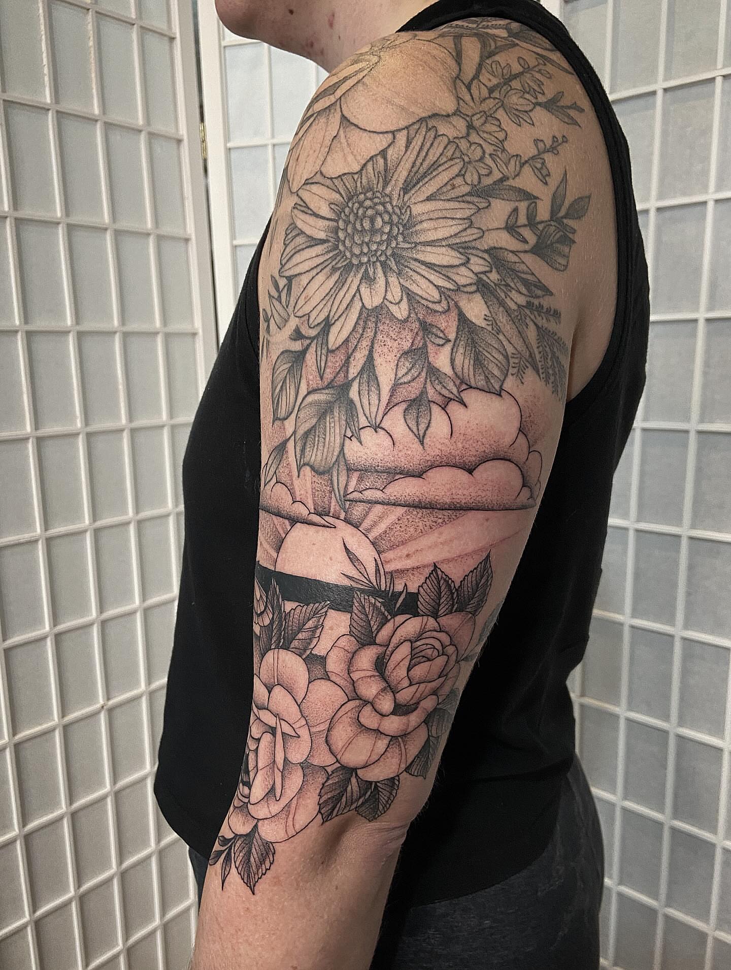 Floral bouquet black and grey tattoo on the upper arm by Tattoos by Dale Hupke, Lebanon, Ohio