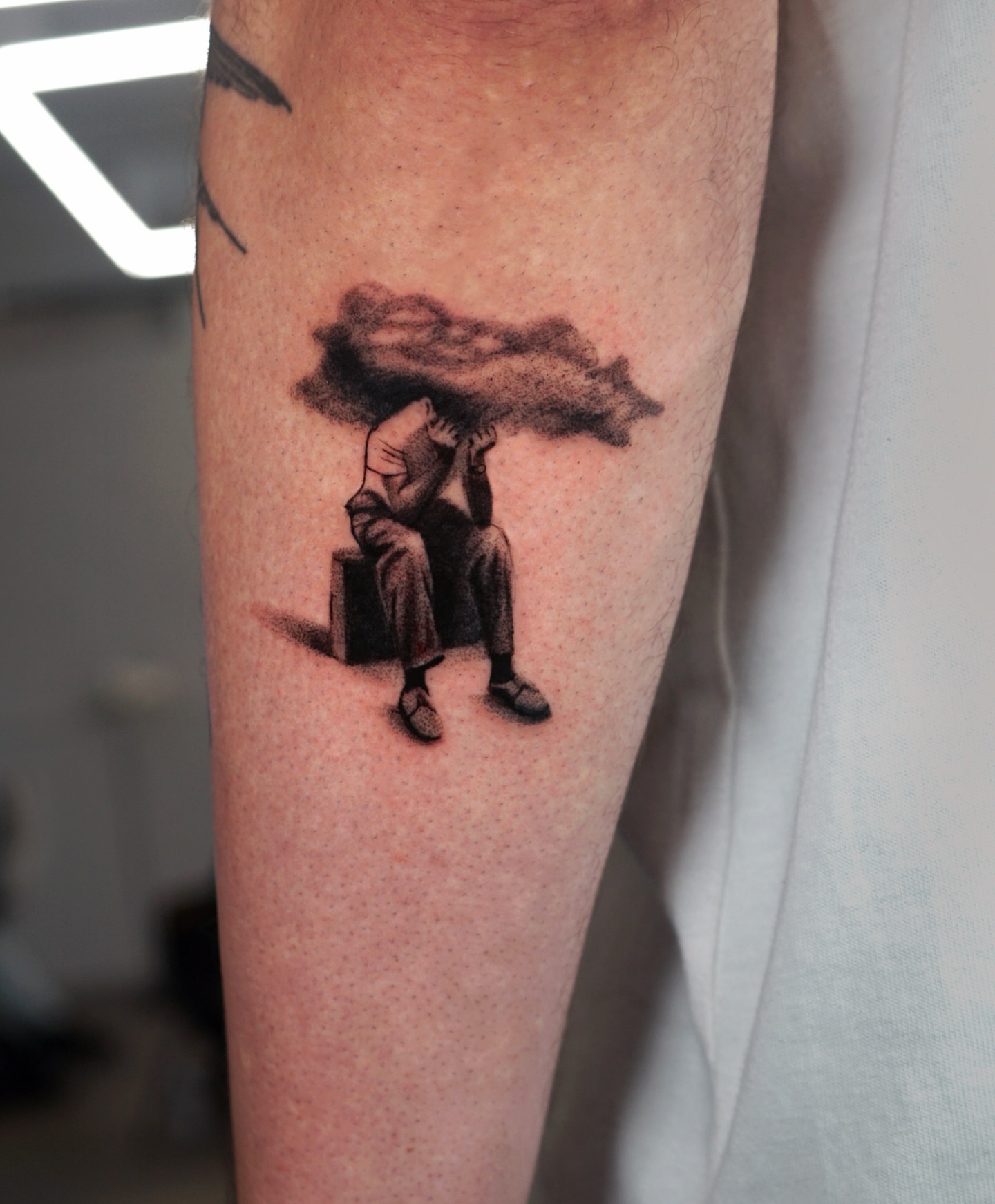Man carrying cloud realism tattoo on the forearm by Metin Karaatli