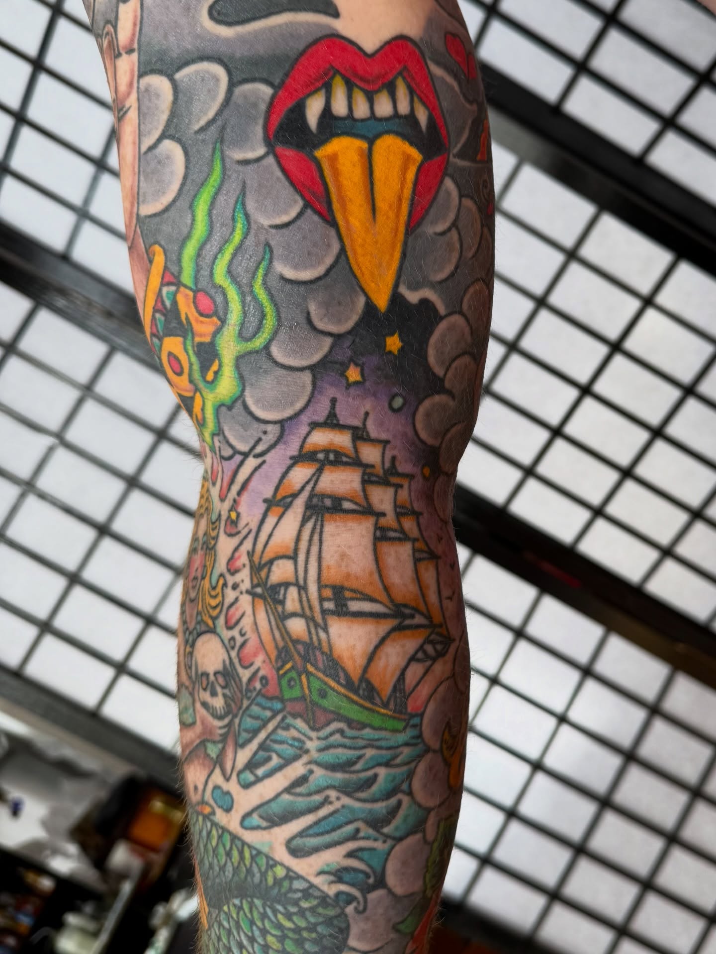 Ship and dragon American traditional tattoo on the forearm by Zak Colburn