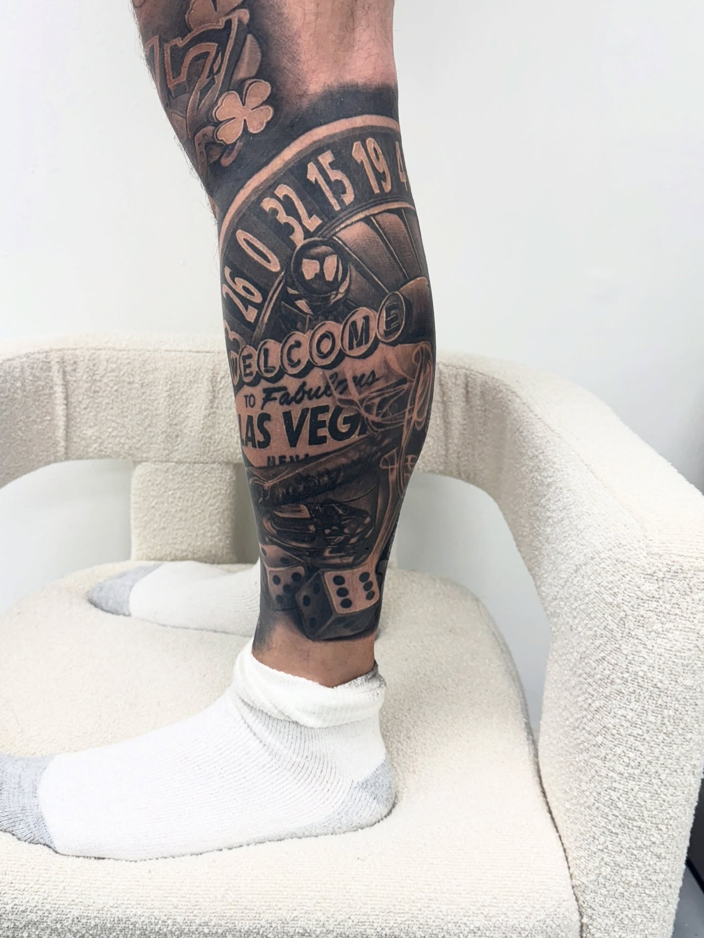 Las vegas welcome sign black and grey tattoo on the calf by Anthony Duran