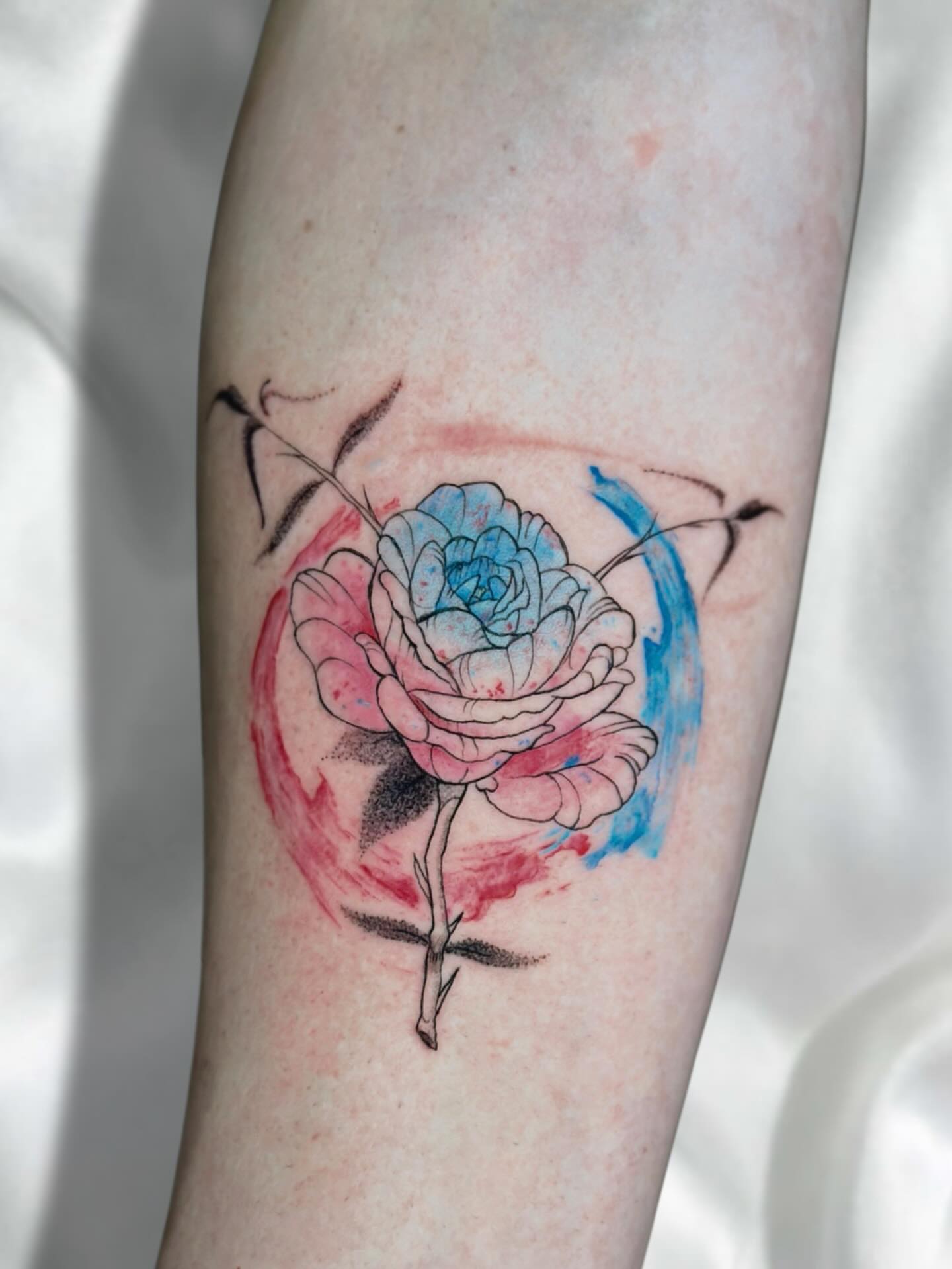 Rose watercolor tattoo on the forearm by Lex