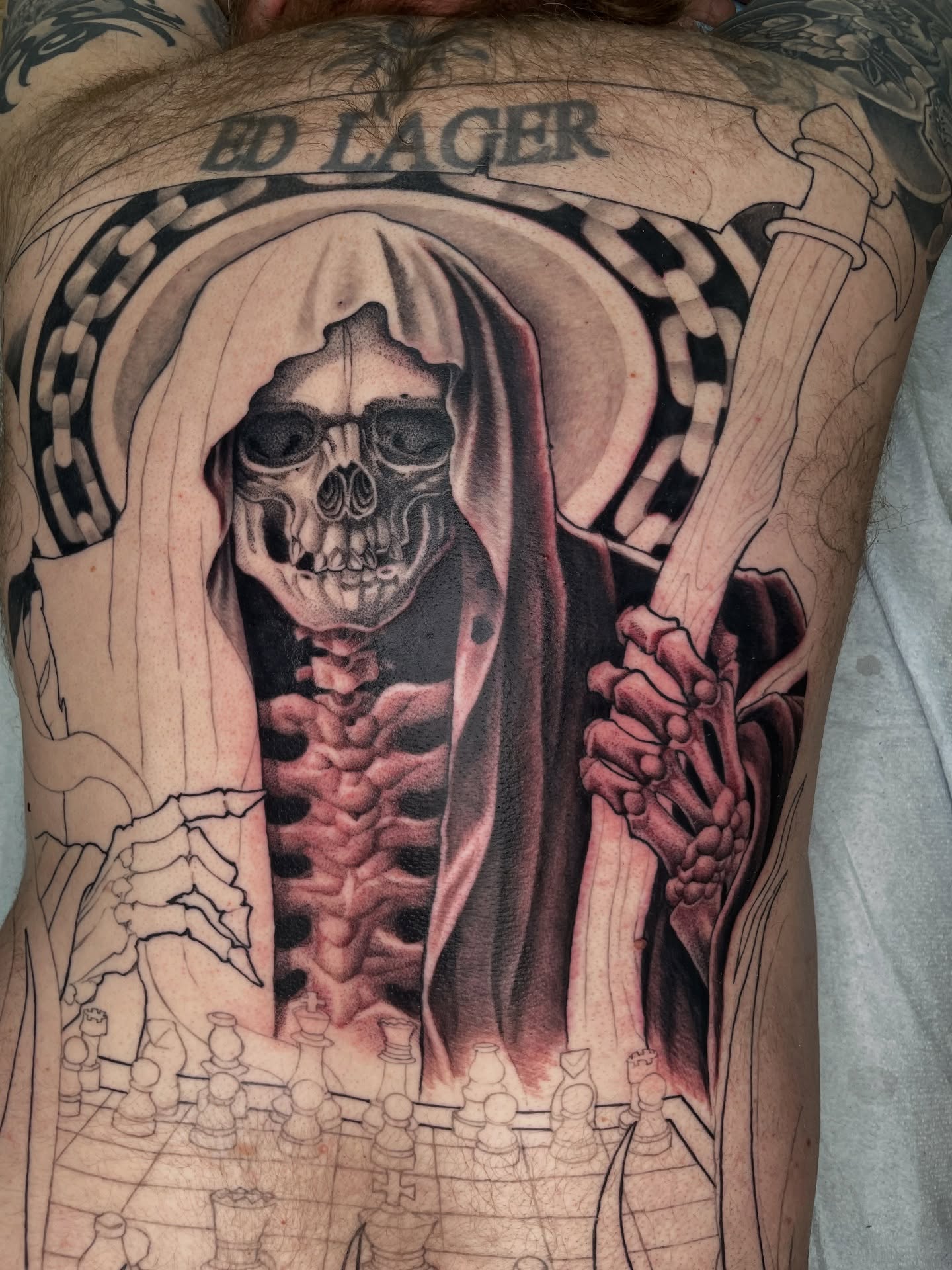 Reaper chessboard realism tattoo on the back by Collie Mills, Philadelphia, Pennsylvania