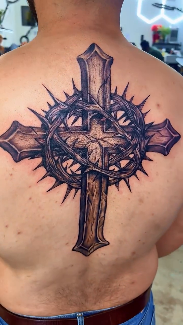 Cross and crown of thorns realism tattoo by Ryan Walker