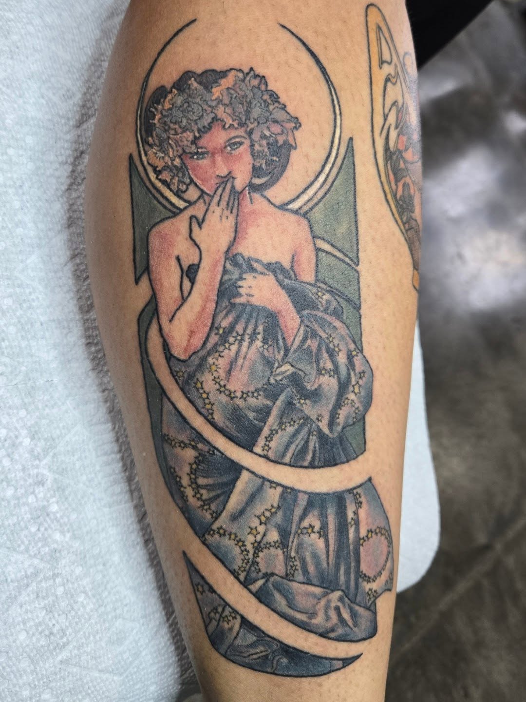 Woman in dress illustrative tattoo on the forearm by Amanda Hinrichs