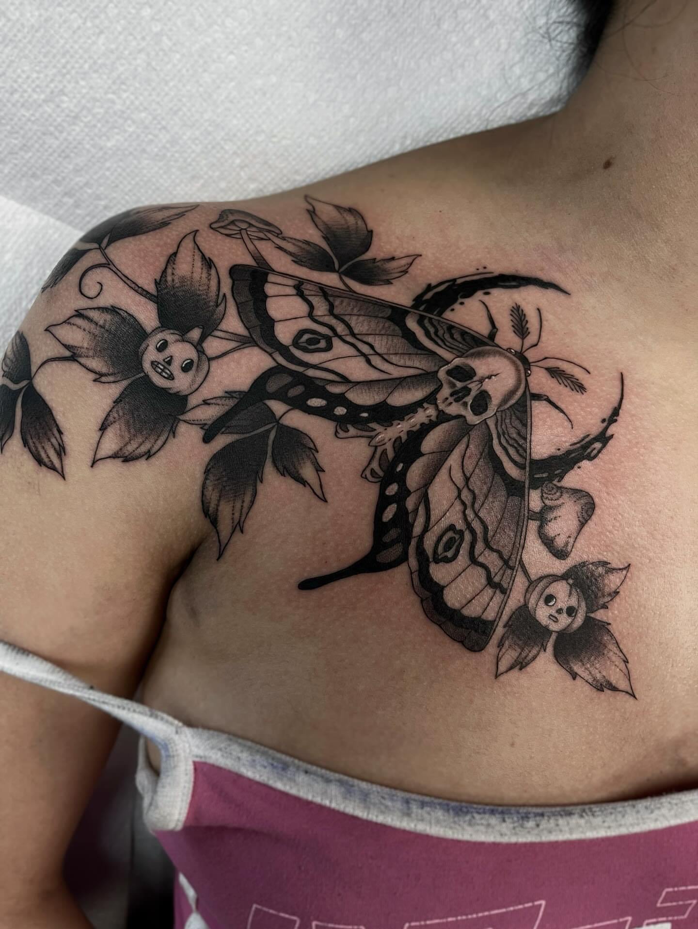 Butterfly and skull dark realism tattoo on the shoulder by Sacramento Tattoos (Ilona)