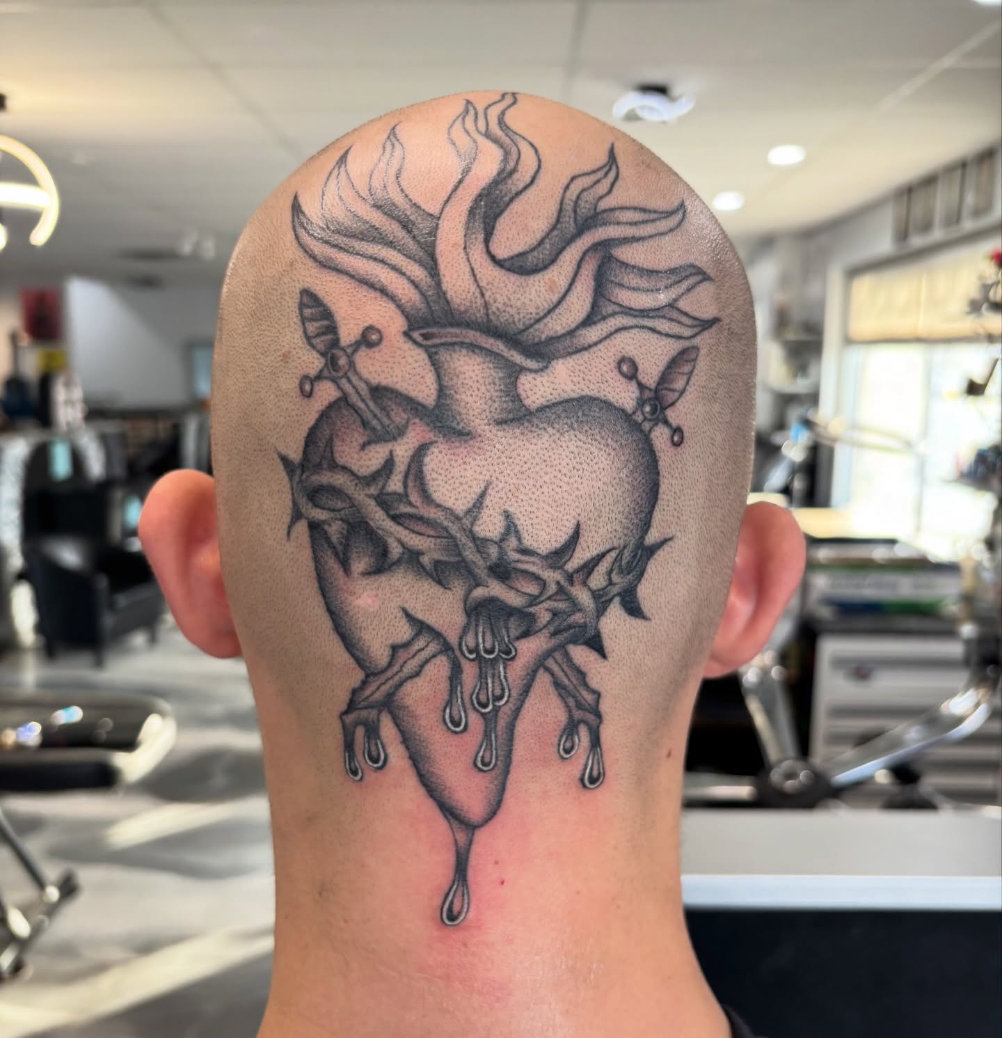 Heart with crown and swords dotwork tattoo on the head by Miklo Montoya