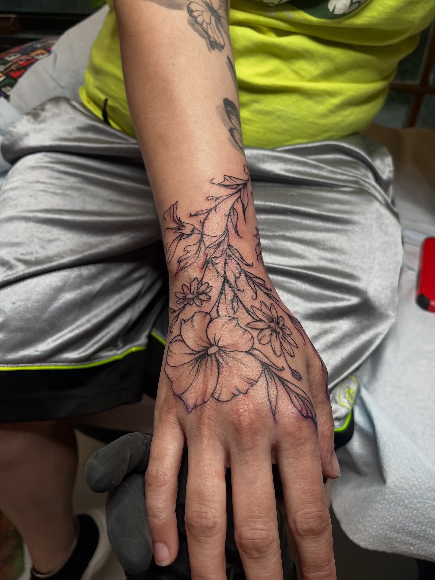 Floral arrangement black and grey tattoo on the hand by ✨ Chris ✨