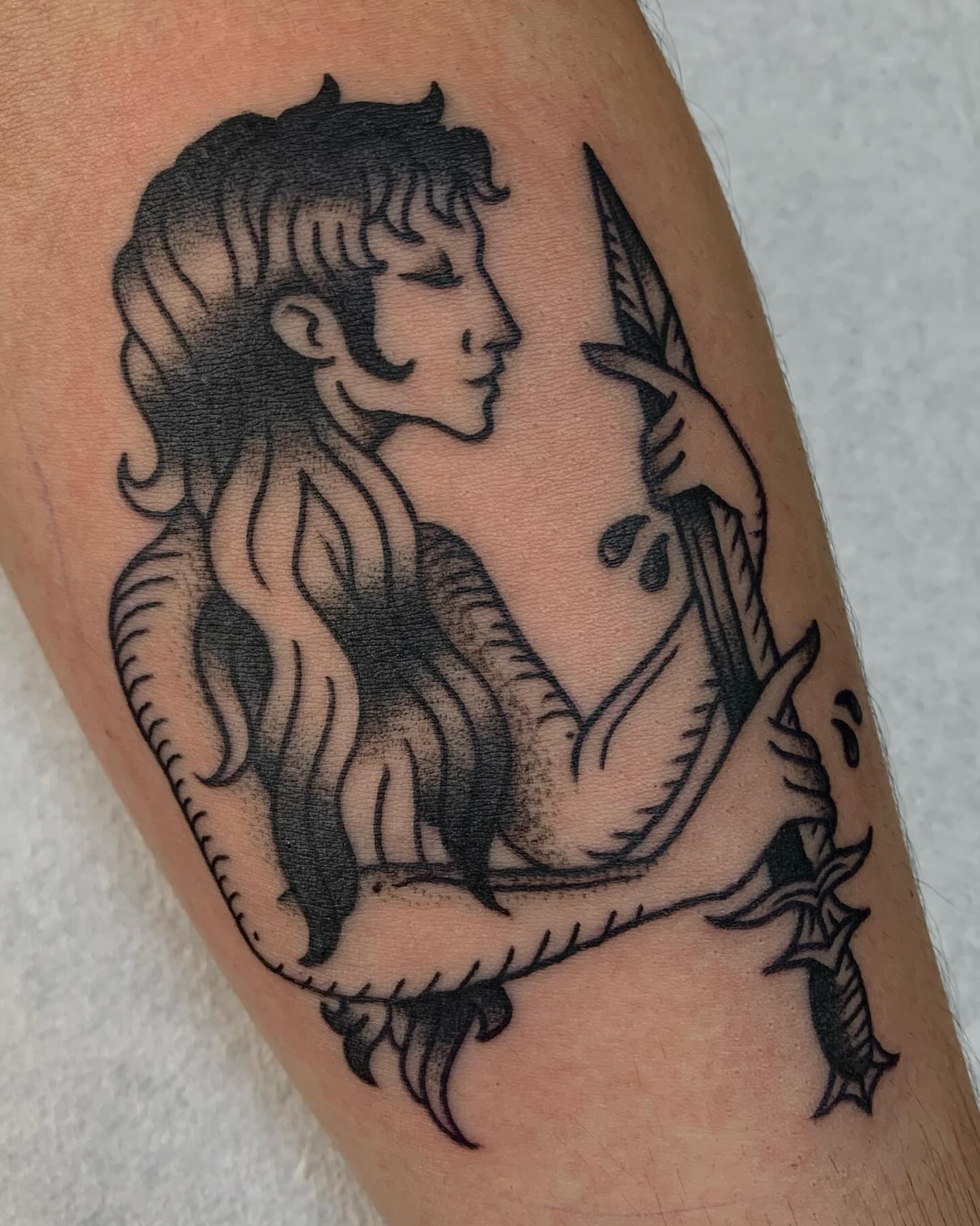 Mermaid black and grey tattoo on the forearm by jay