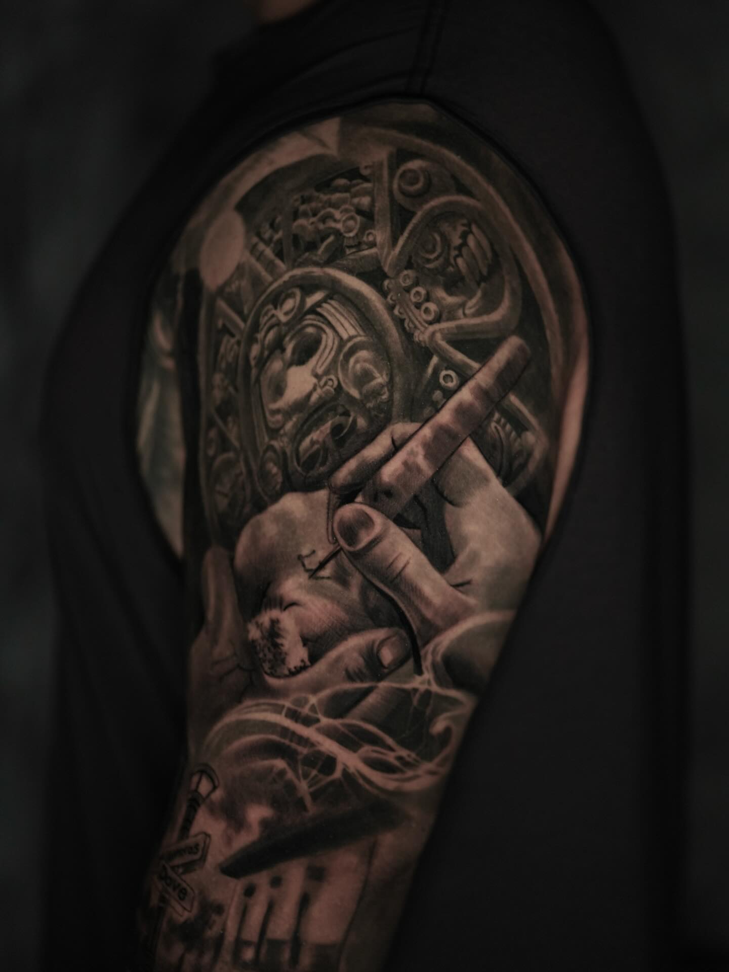 Mythical creature with flute realism tattoo on the upper arm by Tattoos By Chino