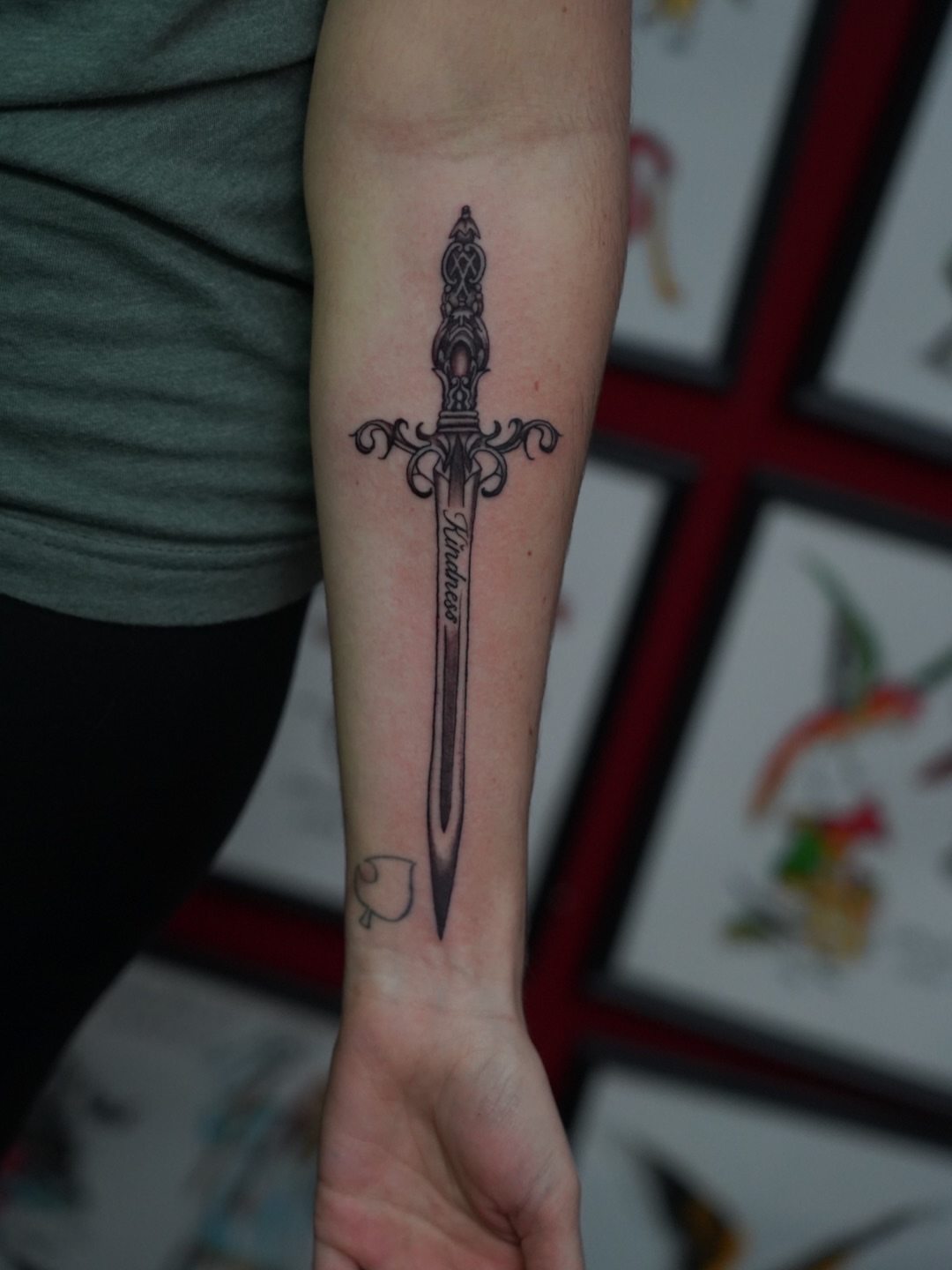 Sword black and grey tattoo on the forearm by Spicoli