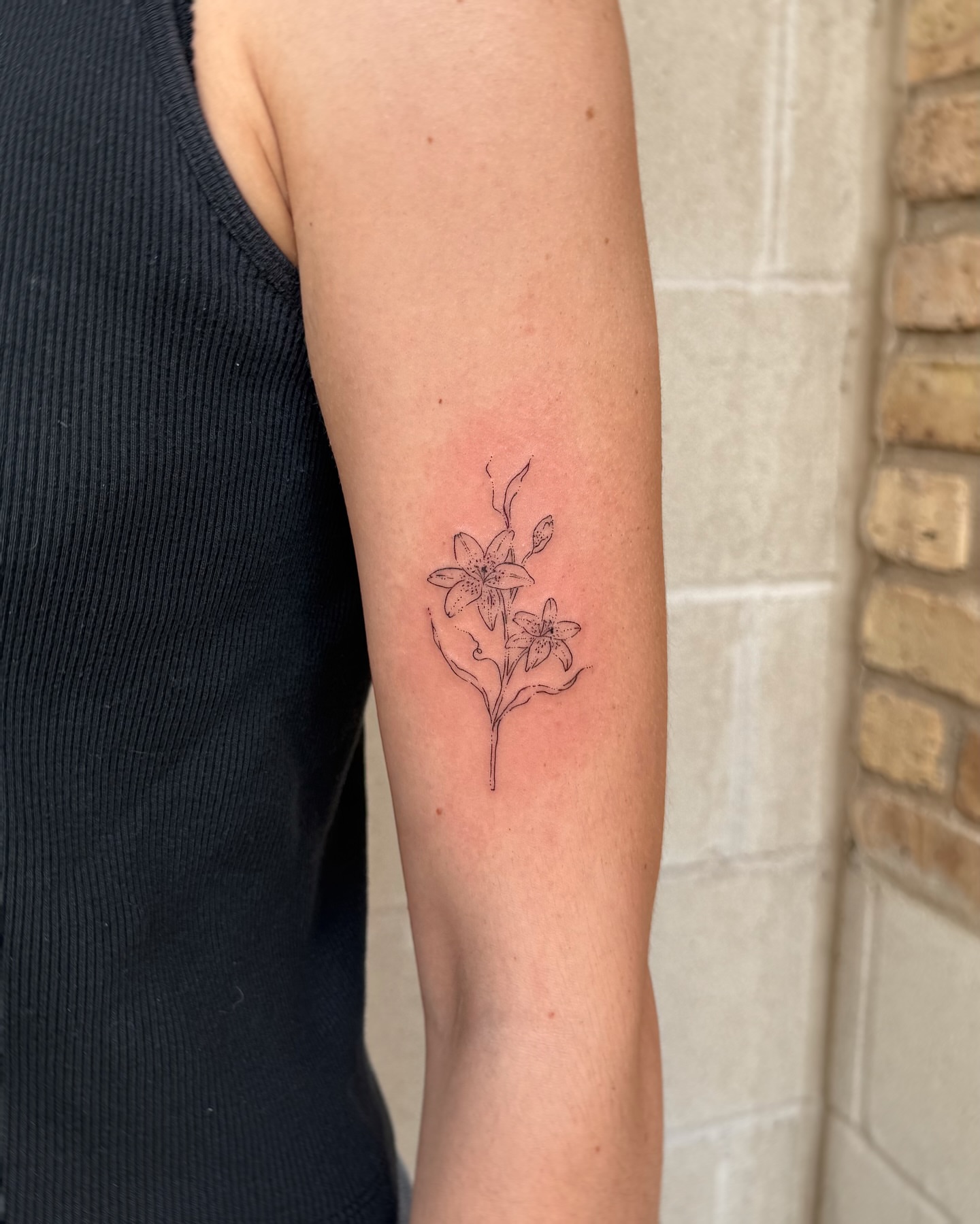 Lily fine line tattoo on the forearm by Inky Apricot, Austin, Texas
