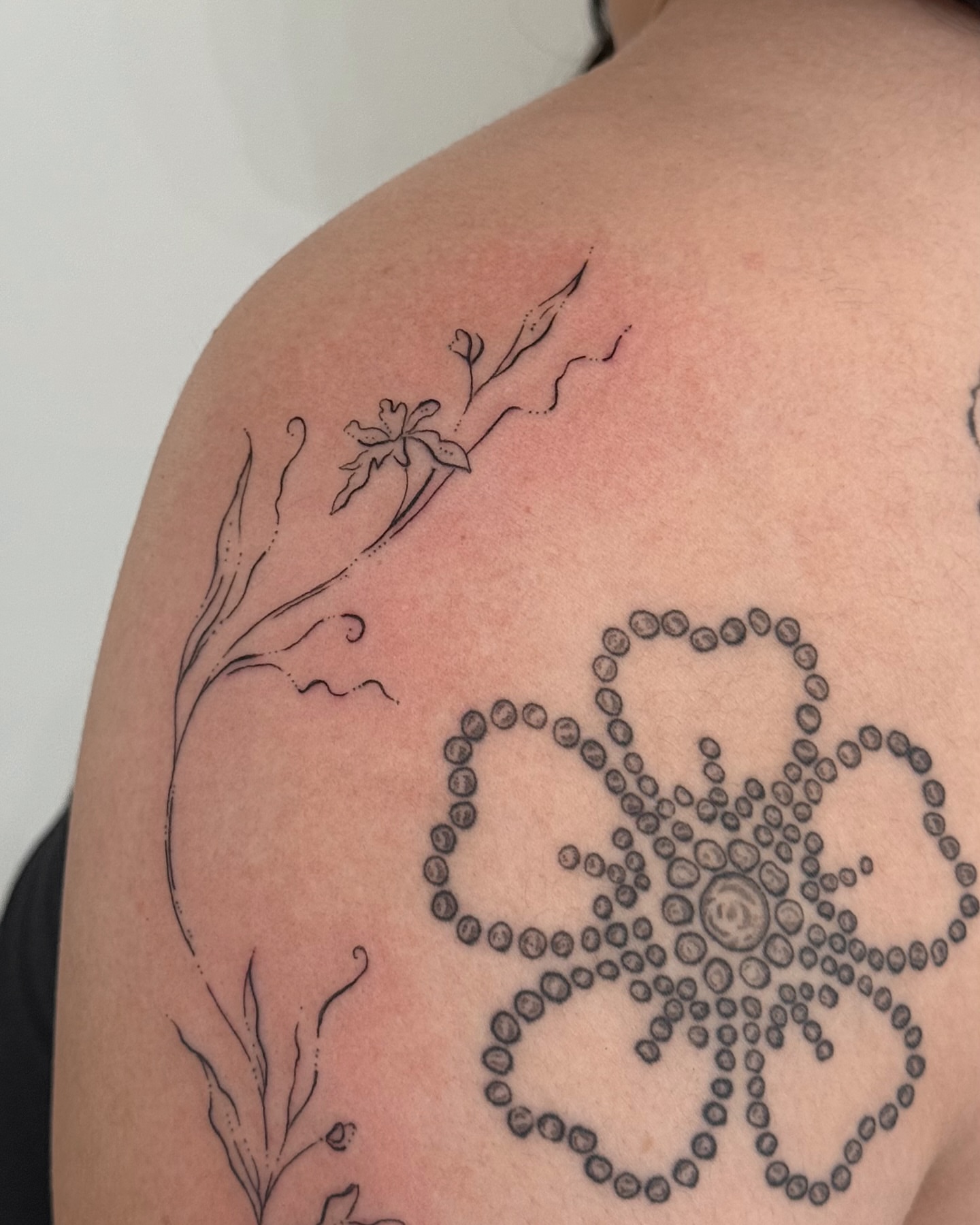 Flower and mandala dotwork tattoo on the shoulder by Inky Apricot, Austin, Texas