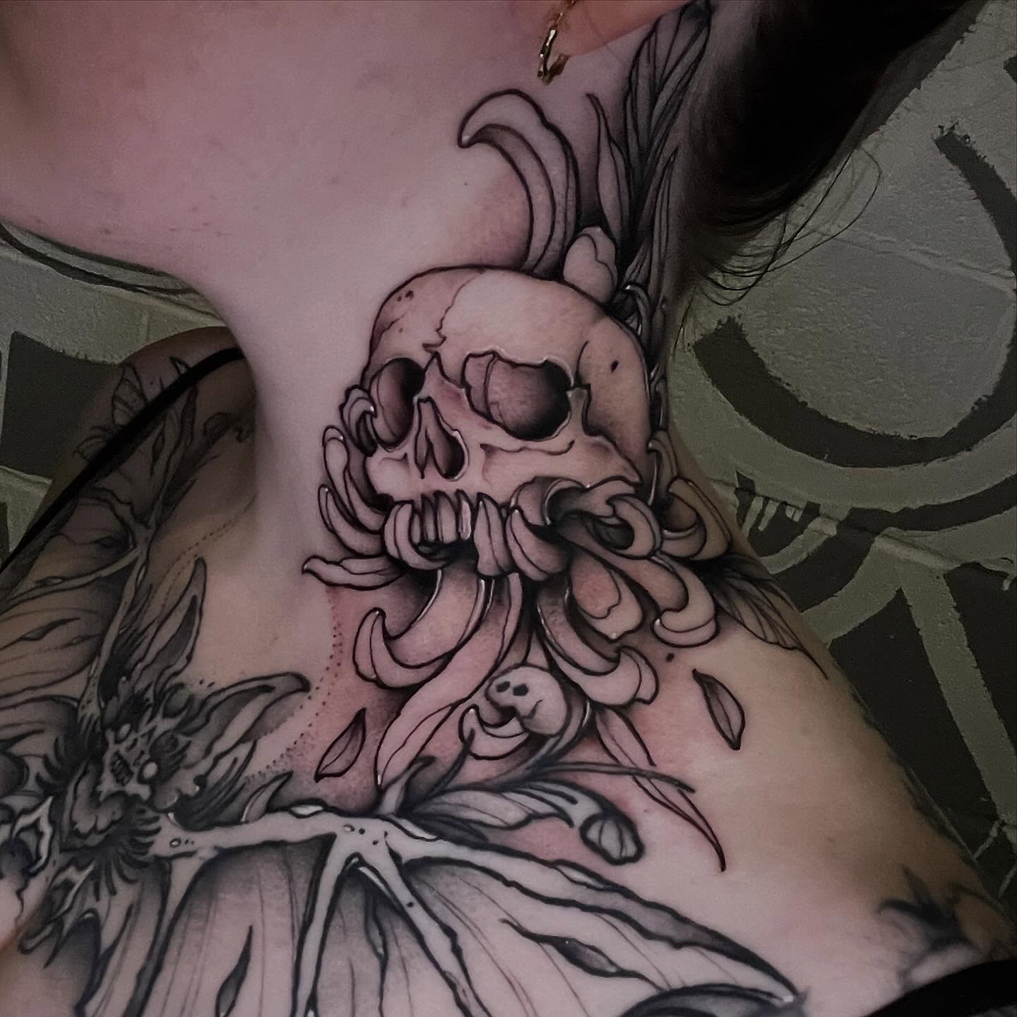 Skull and chain black and grey tattoo on the chest by Brandon Mola, Chicago, Illinois