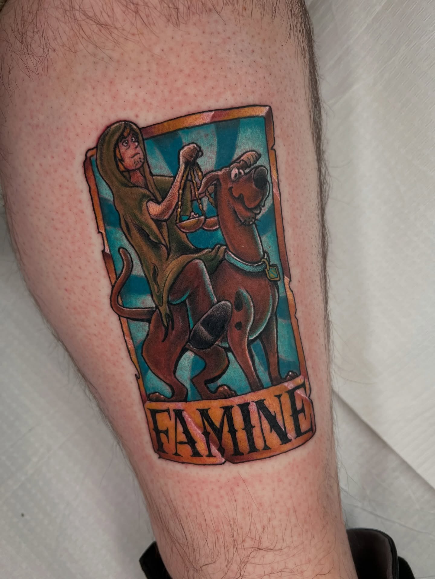 Famine tarot card American traditional tattoo on the forearm by Brandon Durbin