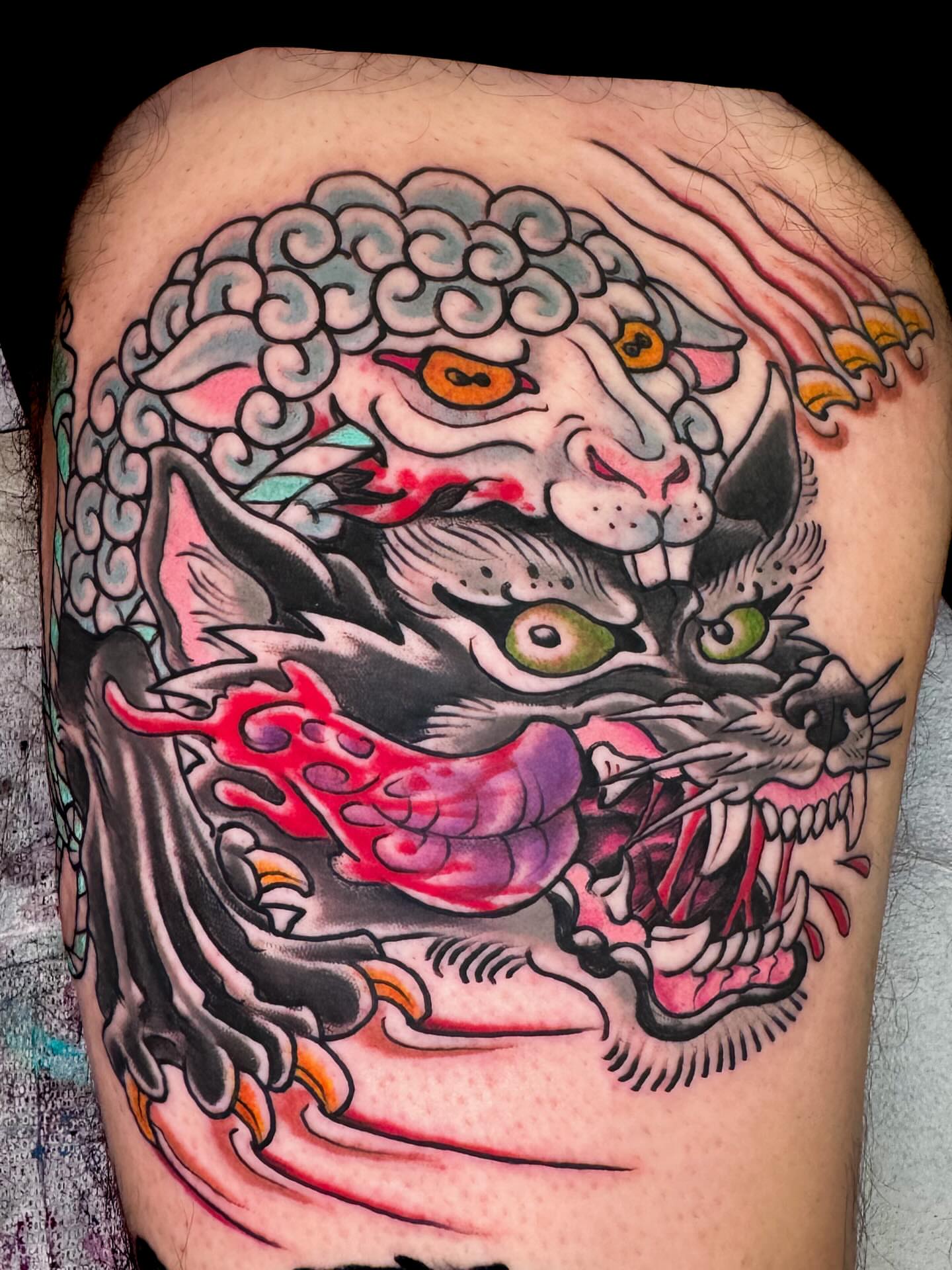 Tiger American traditional tattoo on the thigh by Bob Lackner
