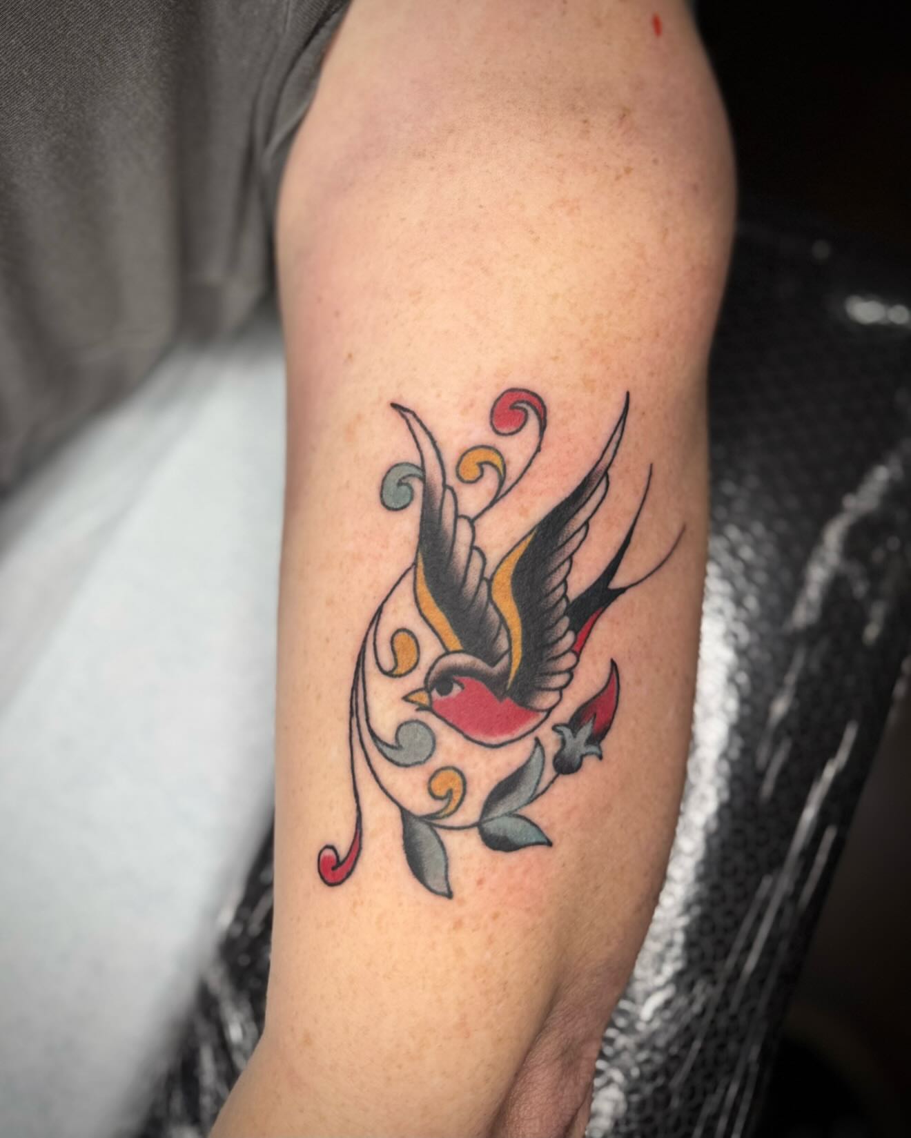 Bird American traditional tattoo on the forearm by kalli berry