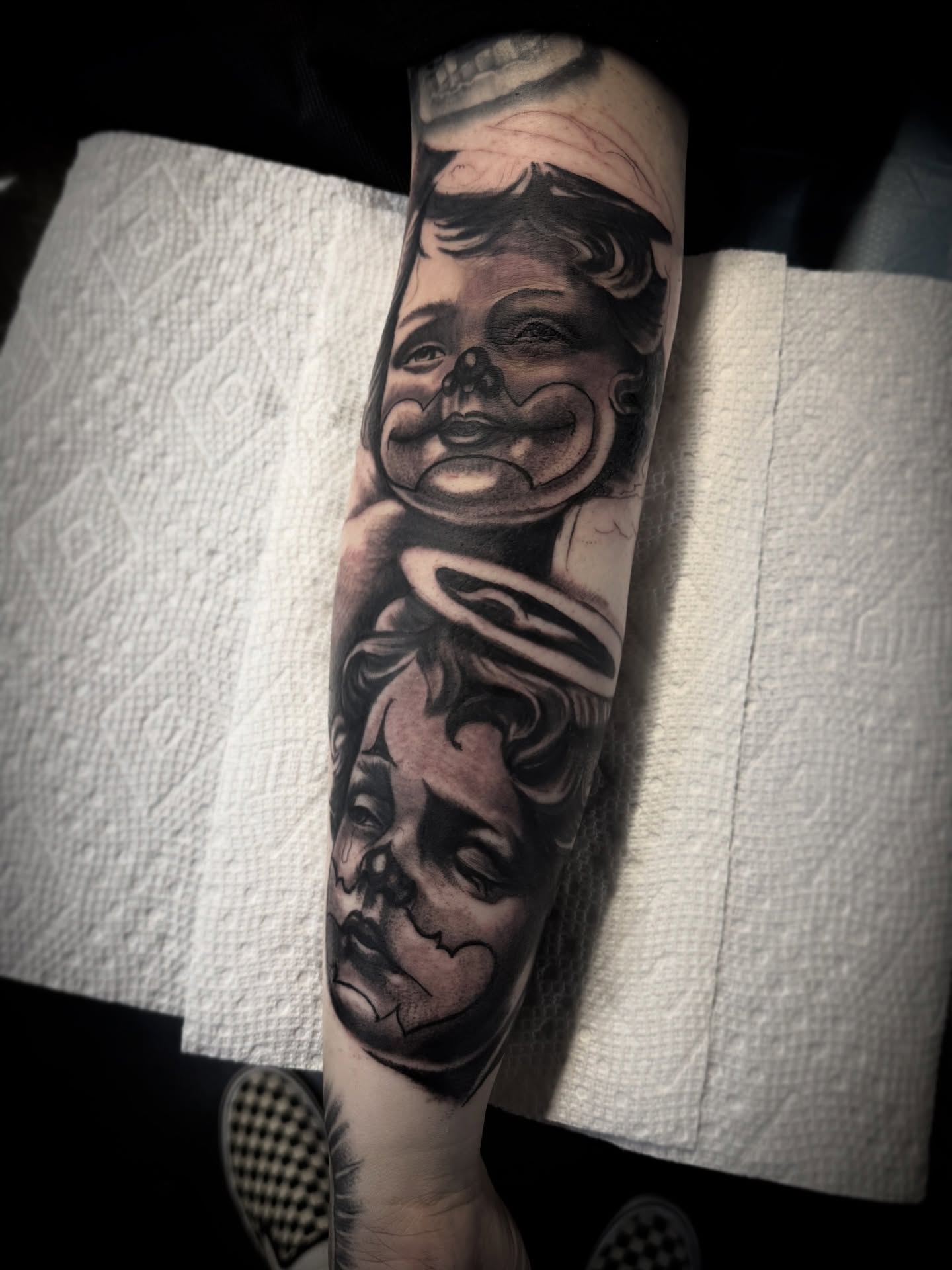 Child's face realism tattoo on the forearm by ♟️SouthEastLA♟️