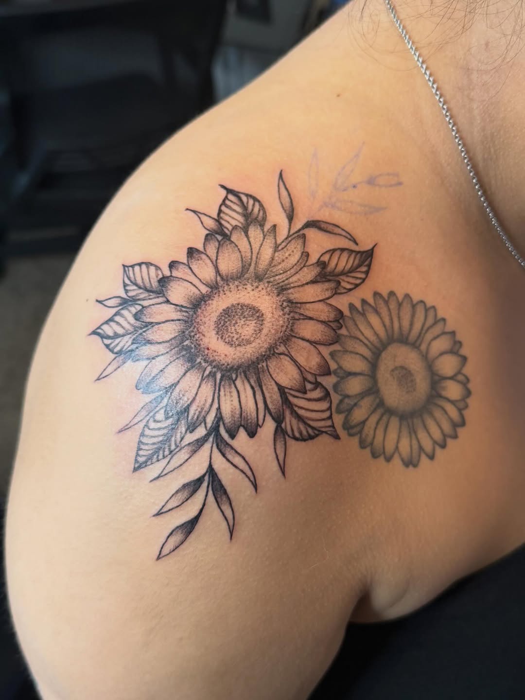 Sunflower bouquet fine line tattoo on the shoulder by Sonia vidal