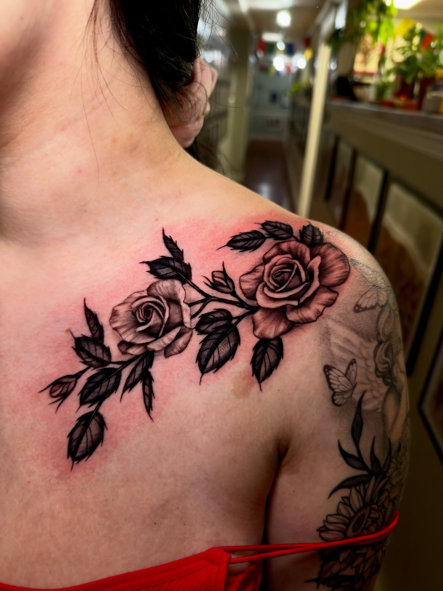 Roses black and grey tattoo on the shoulder by Marisa Biddle