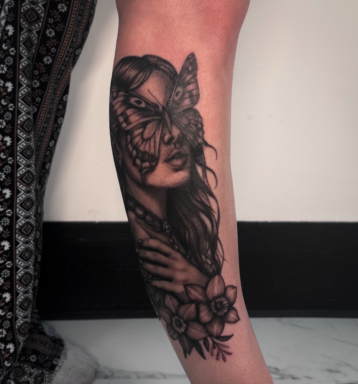 Woman with butterflies realism tattoo on the forearm by utah tattoo artist