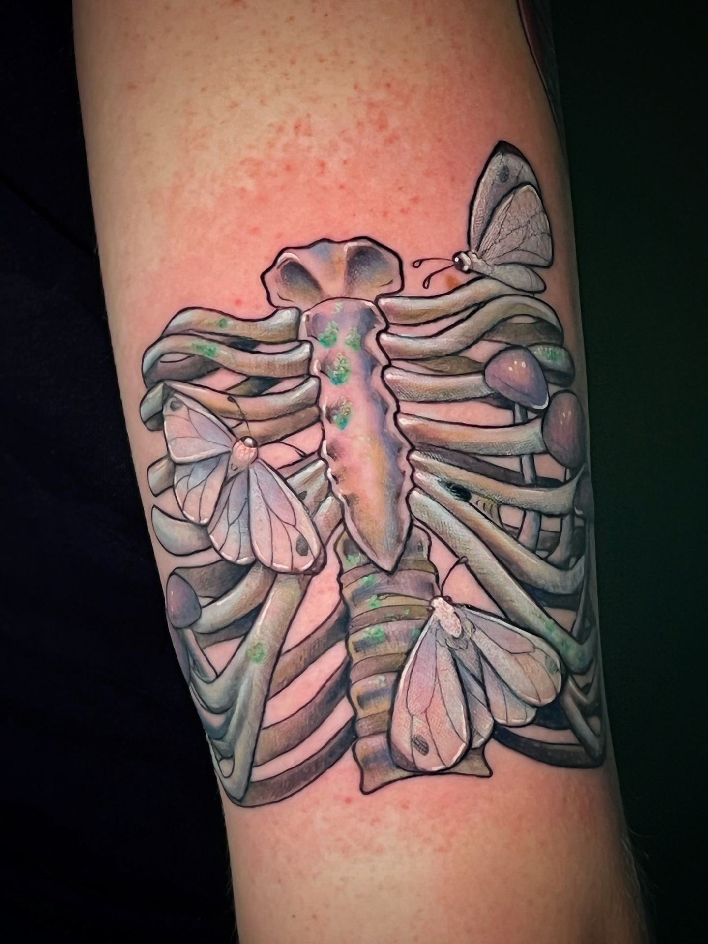 Ribcage with butterflies realism tattoo on the forearm by Michelle Pomerantz 🌼 Portland Tattoo Artist