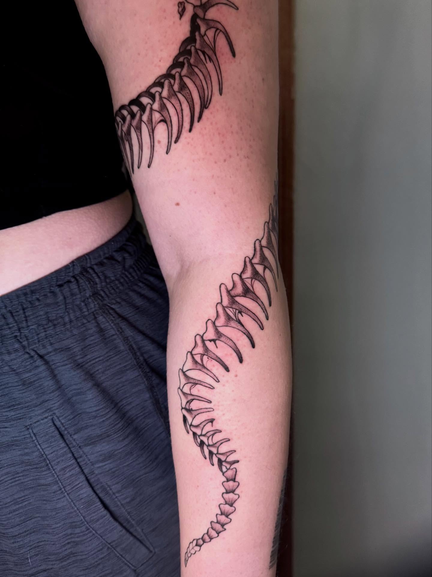 Spine black and grey tattoo on the forearm by Morgan Peeples