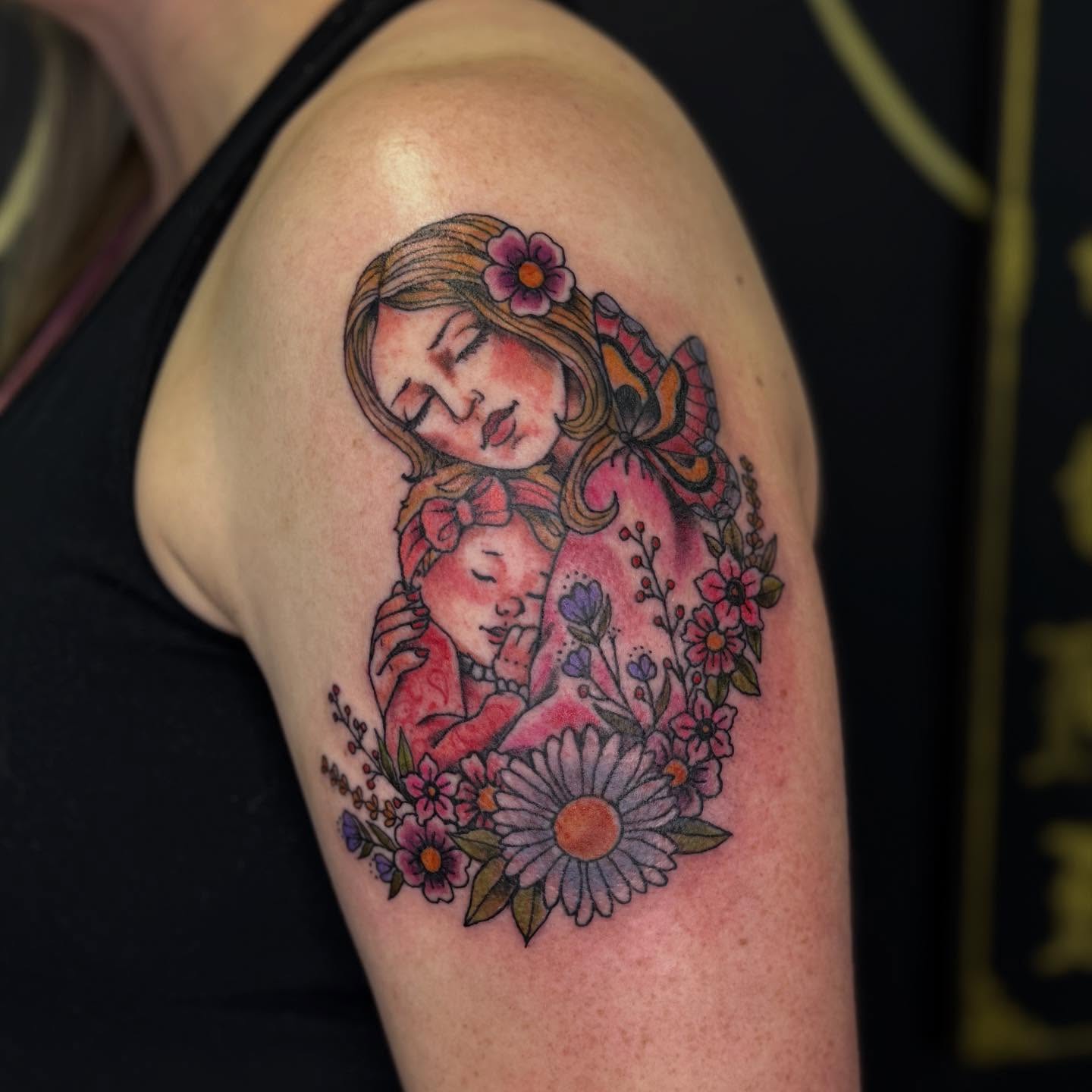 Mother and child new school tattoo on the shoulder by Tattoos By Trish