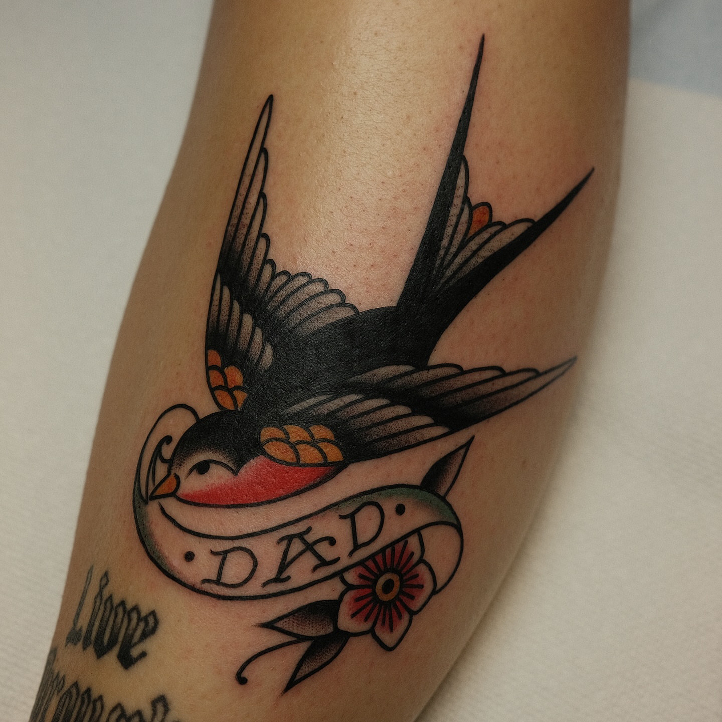 Swallow with banner American traditional tattoo on the forearm by Tony Talbert, Fredericksburg, Virginia