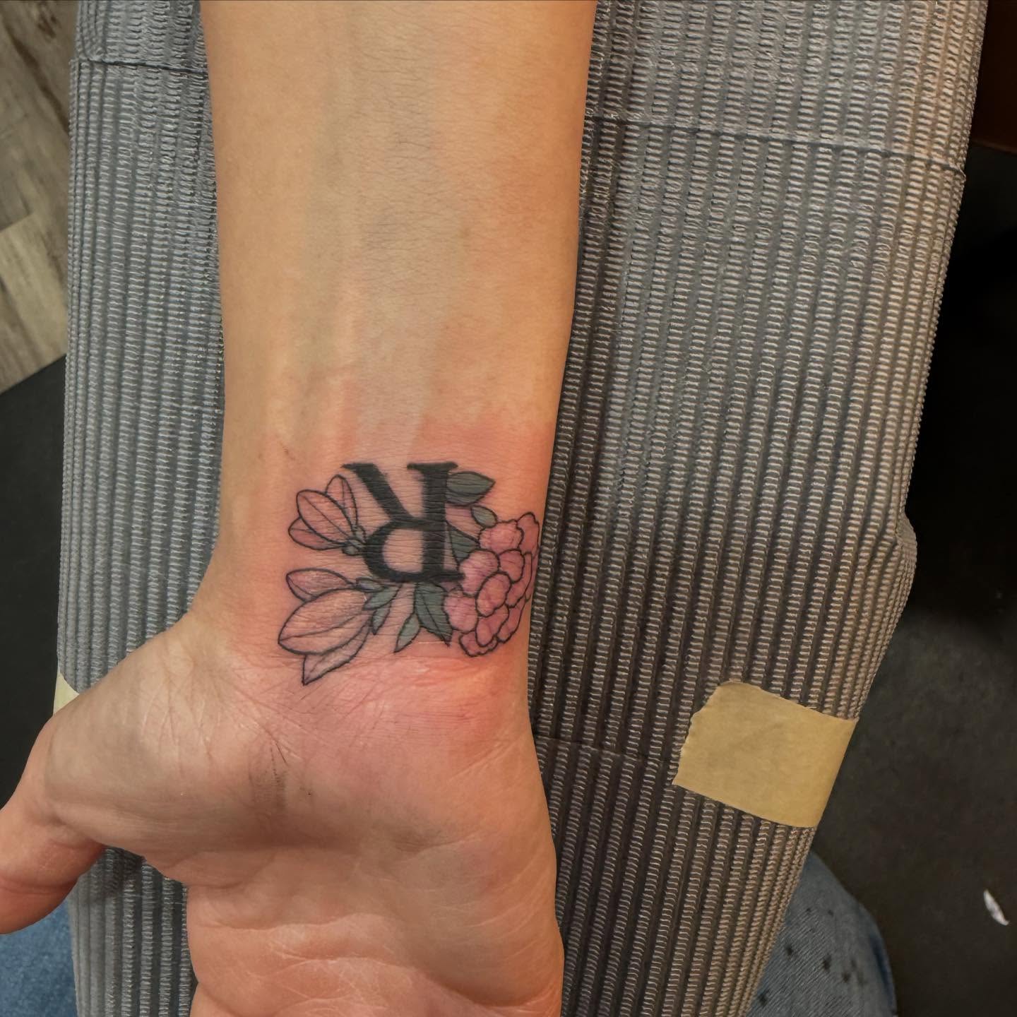 Floral arrangement neo-traditional tattoo on the foot by Brandie Caroline, Somers Point, New Jersey
