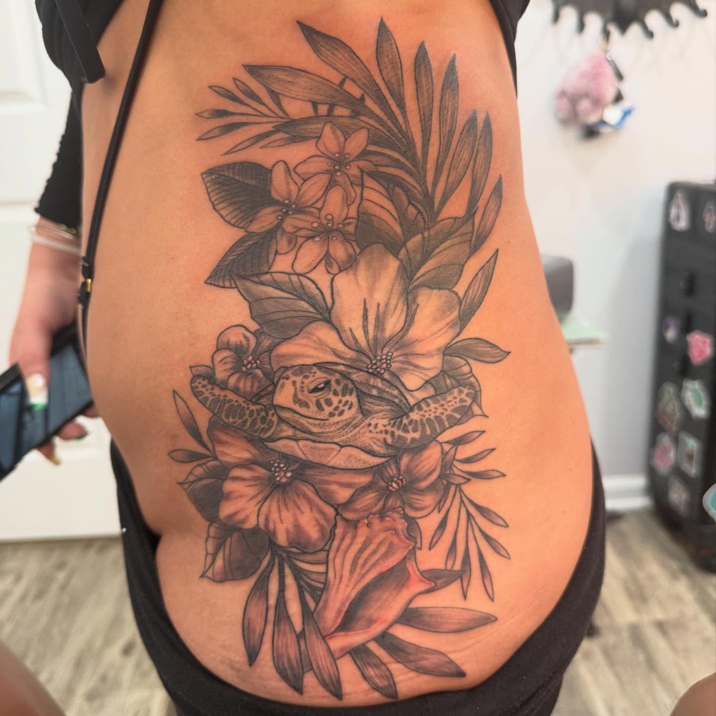 Sea turtle and flowers realism tattoo on the thigh by Brandie Caroline, Somers Point, New Jersey