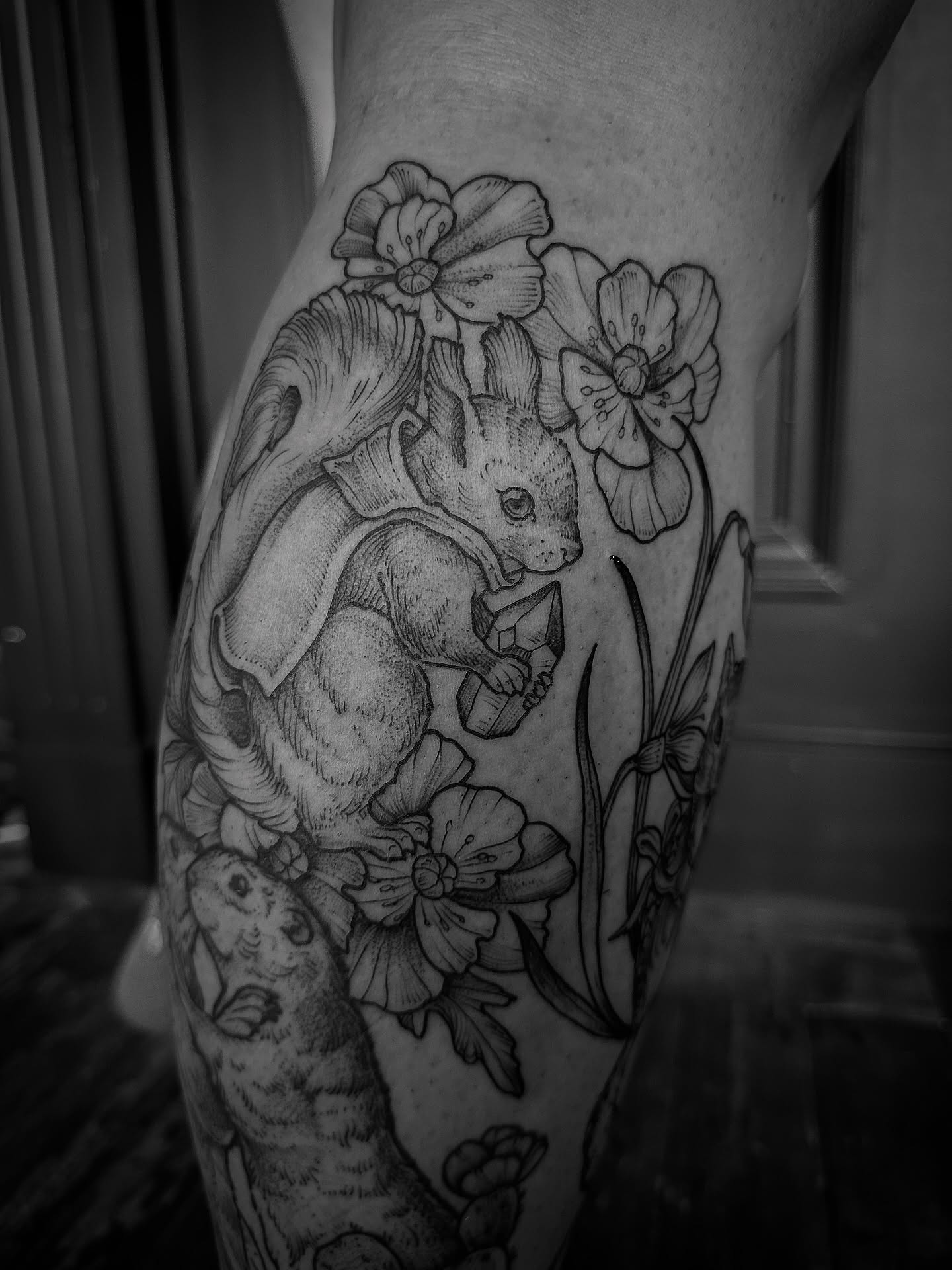 Squirrel and flowers realism tattoo on the forearm by Desireé Keys, Midvale, Utah