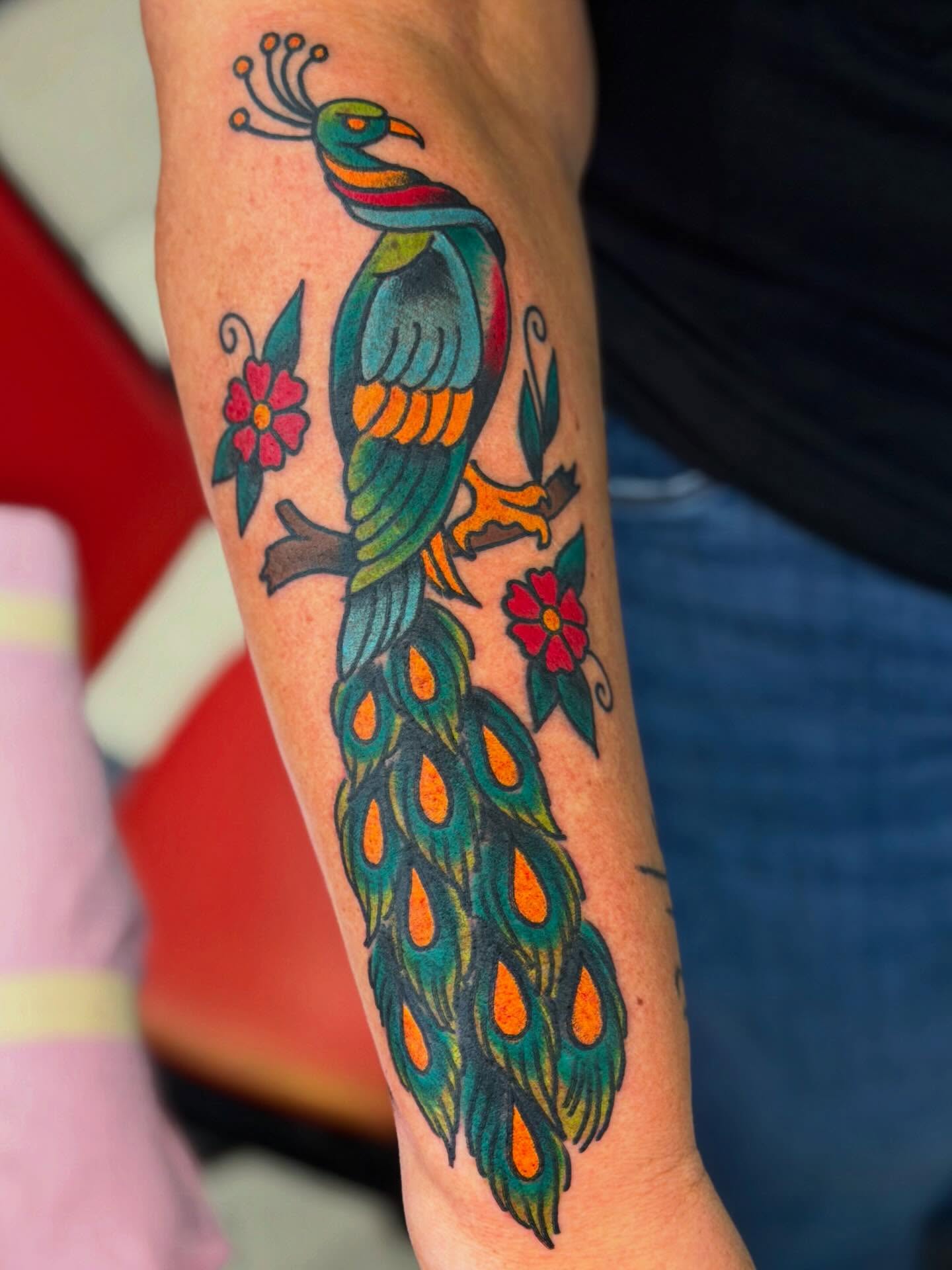 Peacock American traditional tattoo on the forearm by David Steed, Dallas, Texas