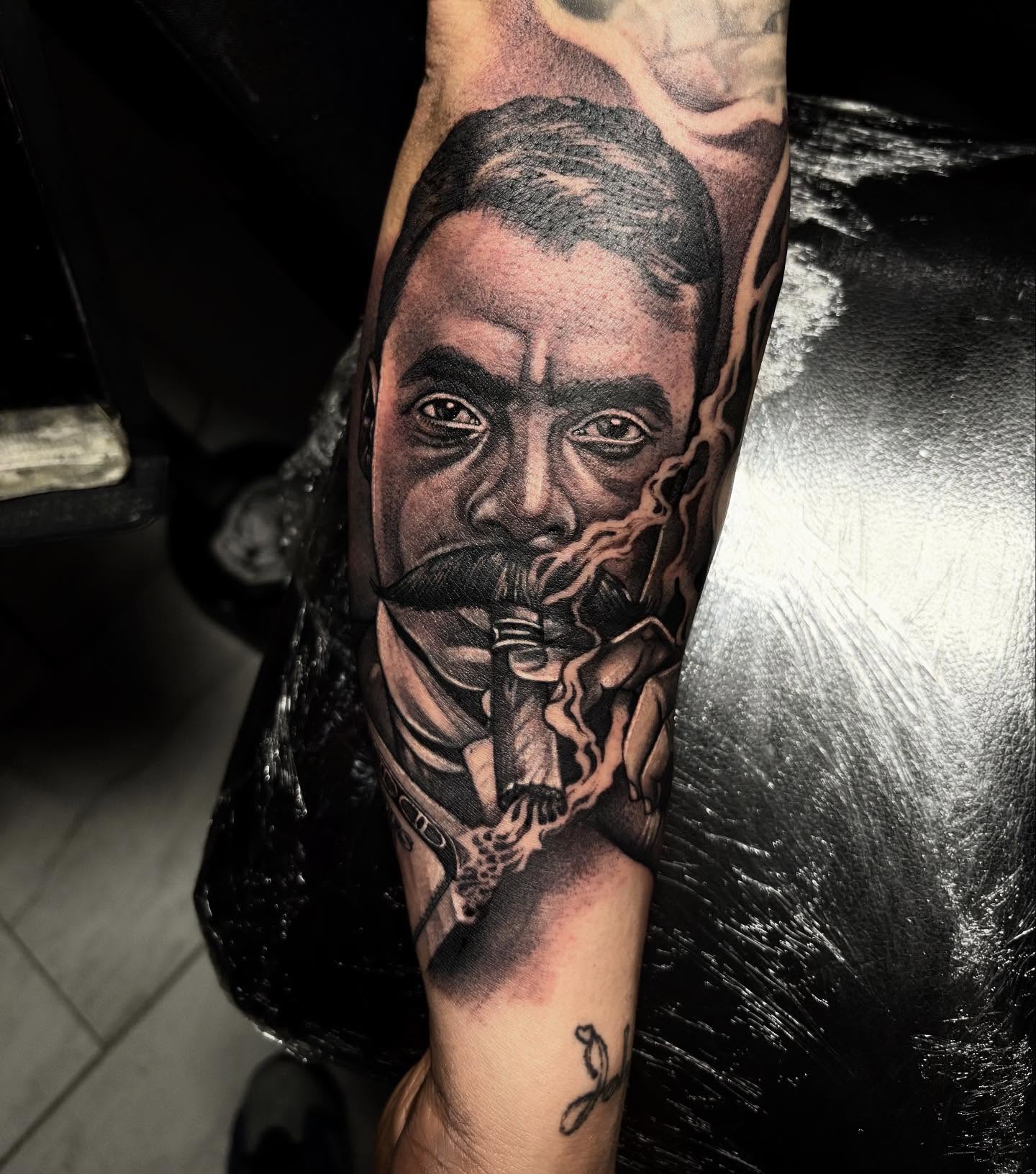 Man smoking pipe realism tattoo on the forearm by Juan Lira