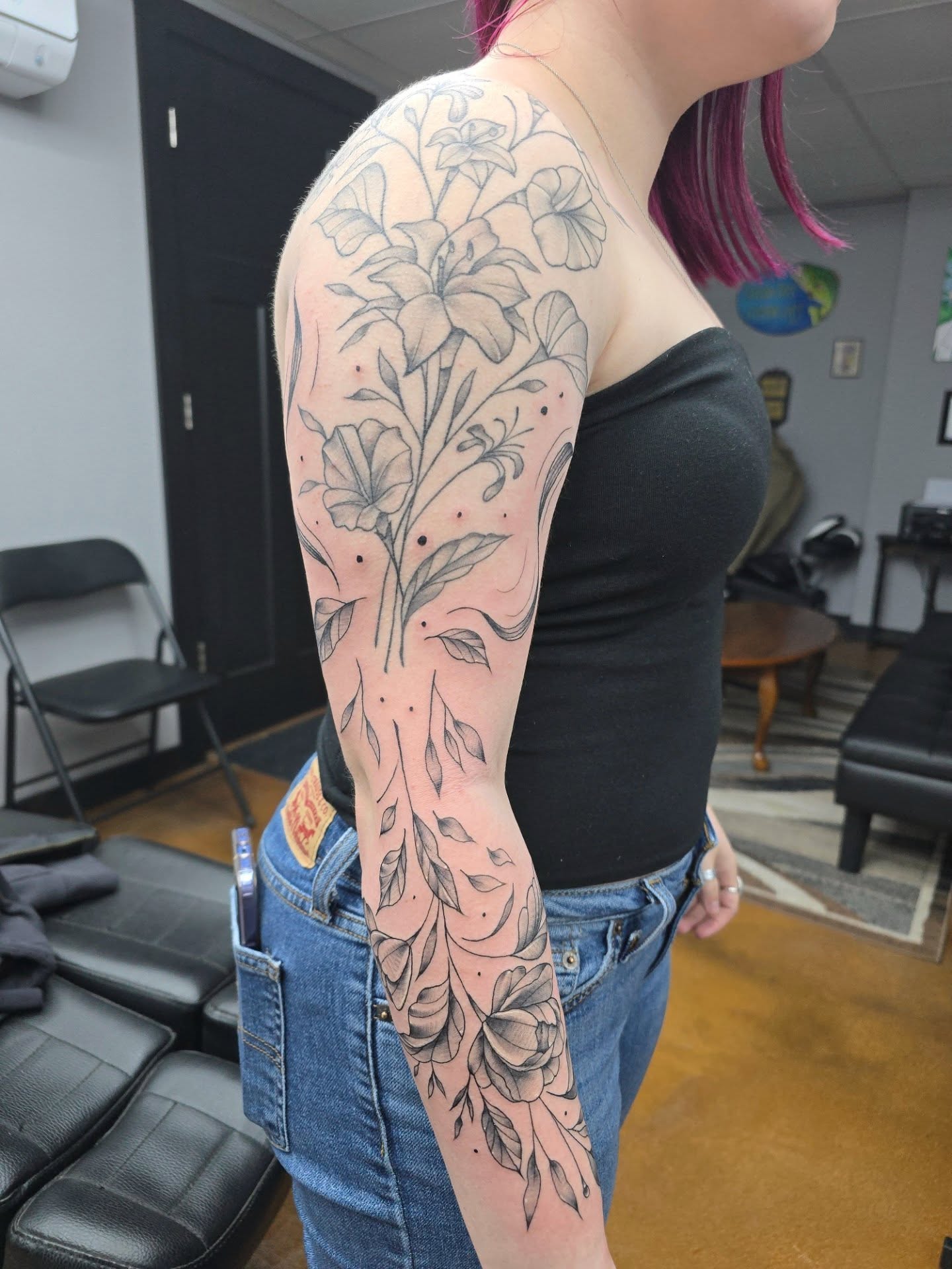 Floral arrangement black and grey tattoo on the upper arm by Jon Griffin, Maryville, Tennessee