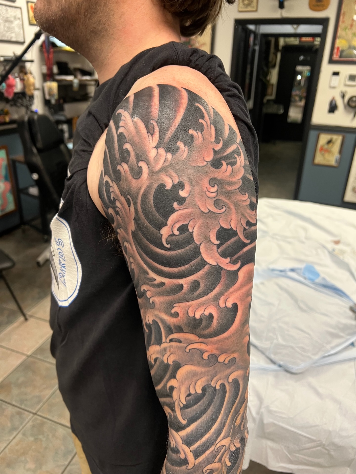 Waves japanese irezumi tattoo on the upper arm by Corey Thompson, Butler, Pennsylvania