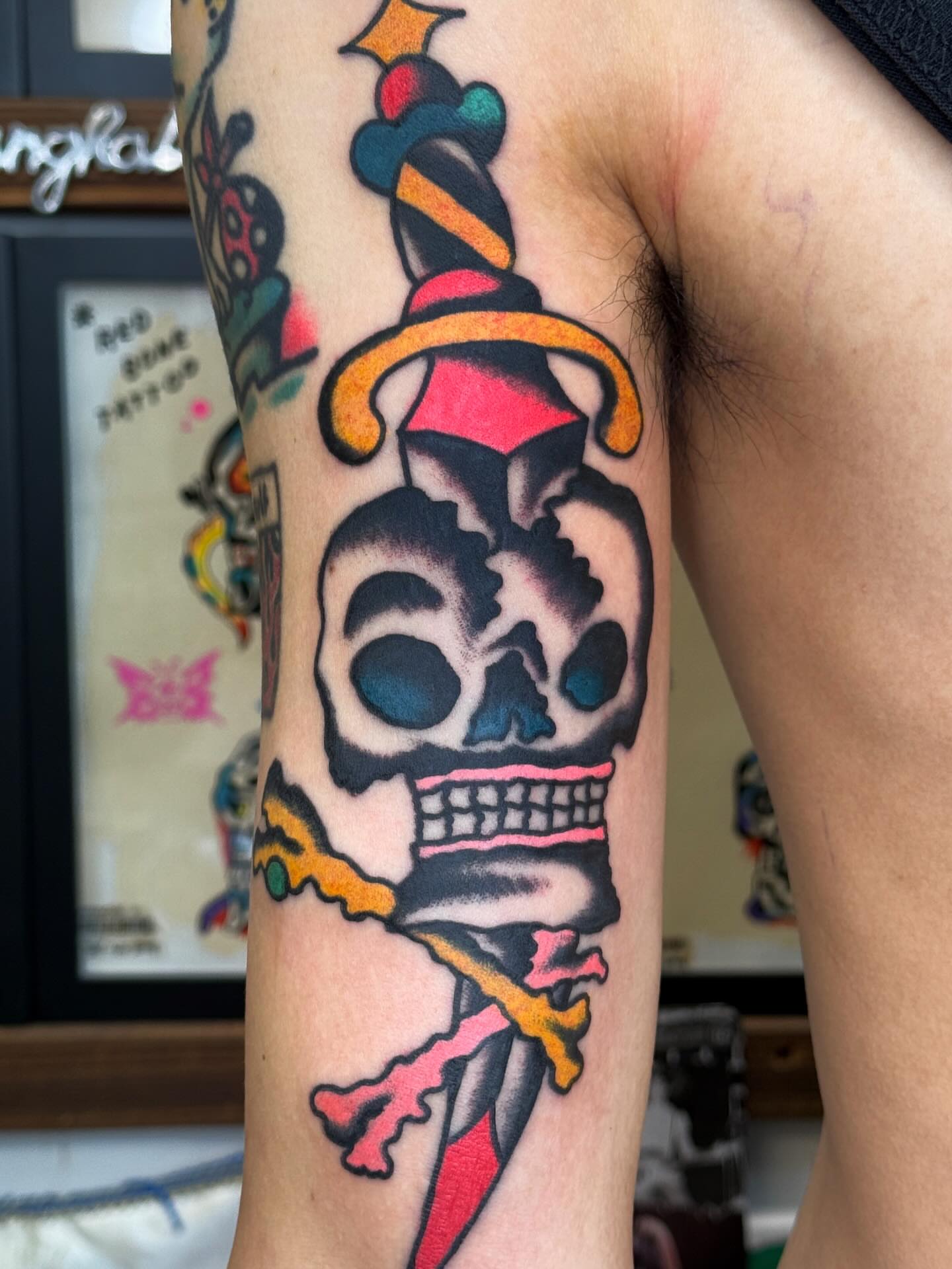 Skull and dagger American traditional tattoo on the forearm by Jimmy Ho
